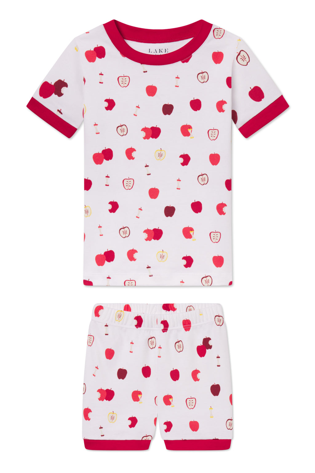 The Kids Shorts Set in Apple Orchard is a two-piece Pima cotton set with a white background, red trim, and playful apple print on the short-sleeve top and shorts.