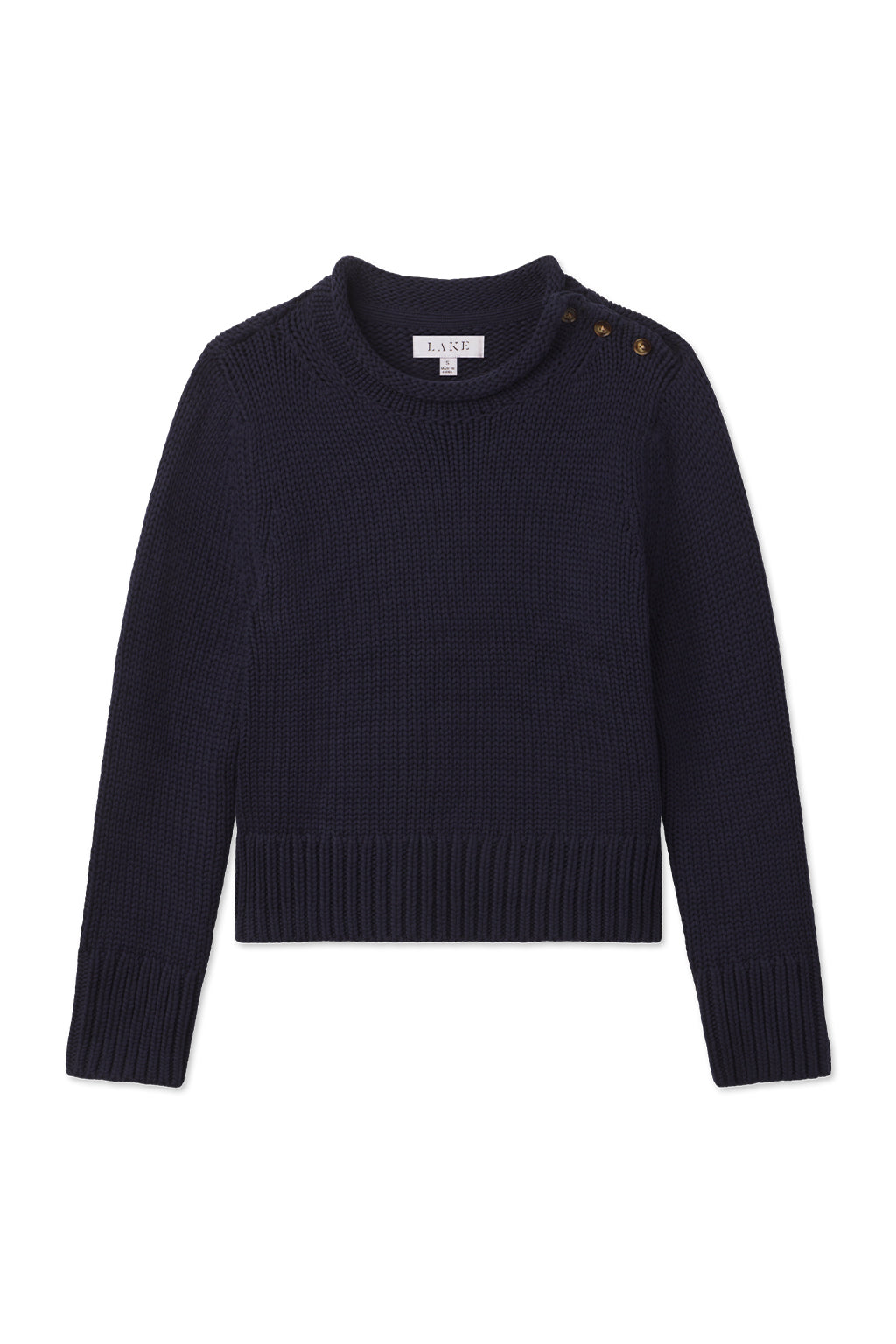 The Jane Cotton Sweater in English Navy features long sleeves, ribbed cuffs and hem, and three gold buttons on one shoulder. Made from 100% cotton, this sweater is shown on a white background.