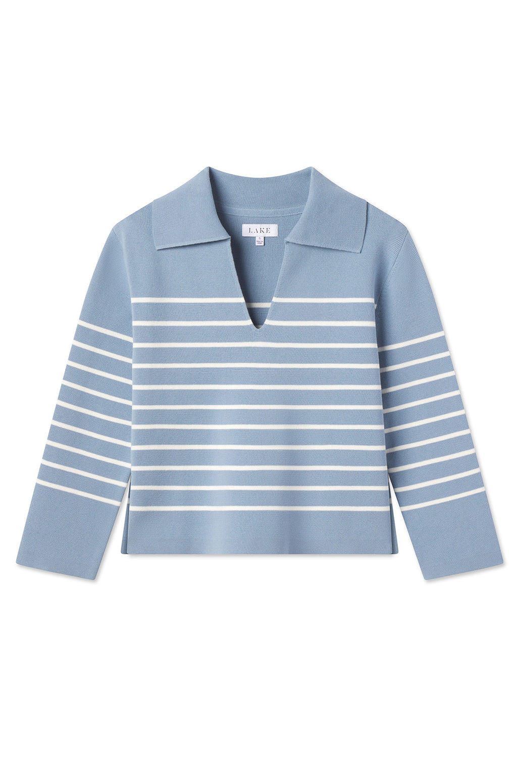 The Lydia Cotton Sweater in Dusty Blue Ivory Stripe is made from 100% cotton and features a wide V-neck, flat collar, long sleeves, and stripes that are denser at the arms and more spaced near the center.