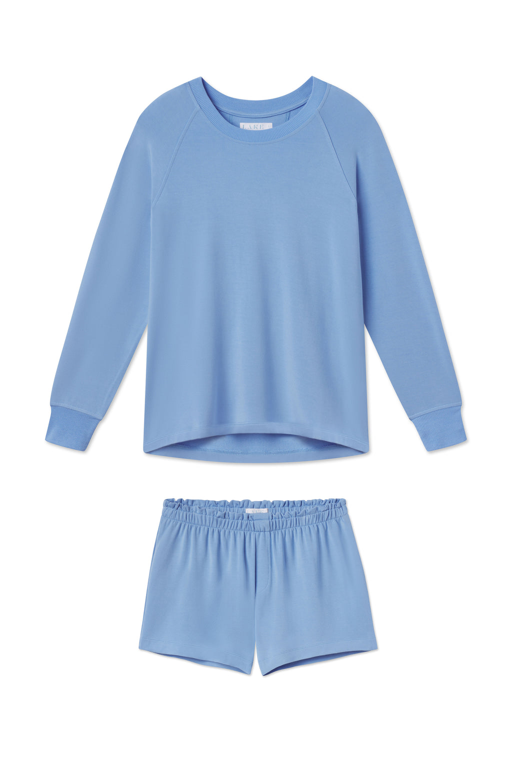 The Relax Shorts Set in Baltic Blue, shown laid flat on a white background, includes a long-sleeve crew neck top and matching elastic-waist shorts.