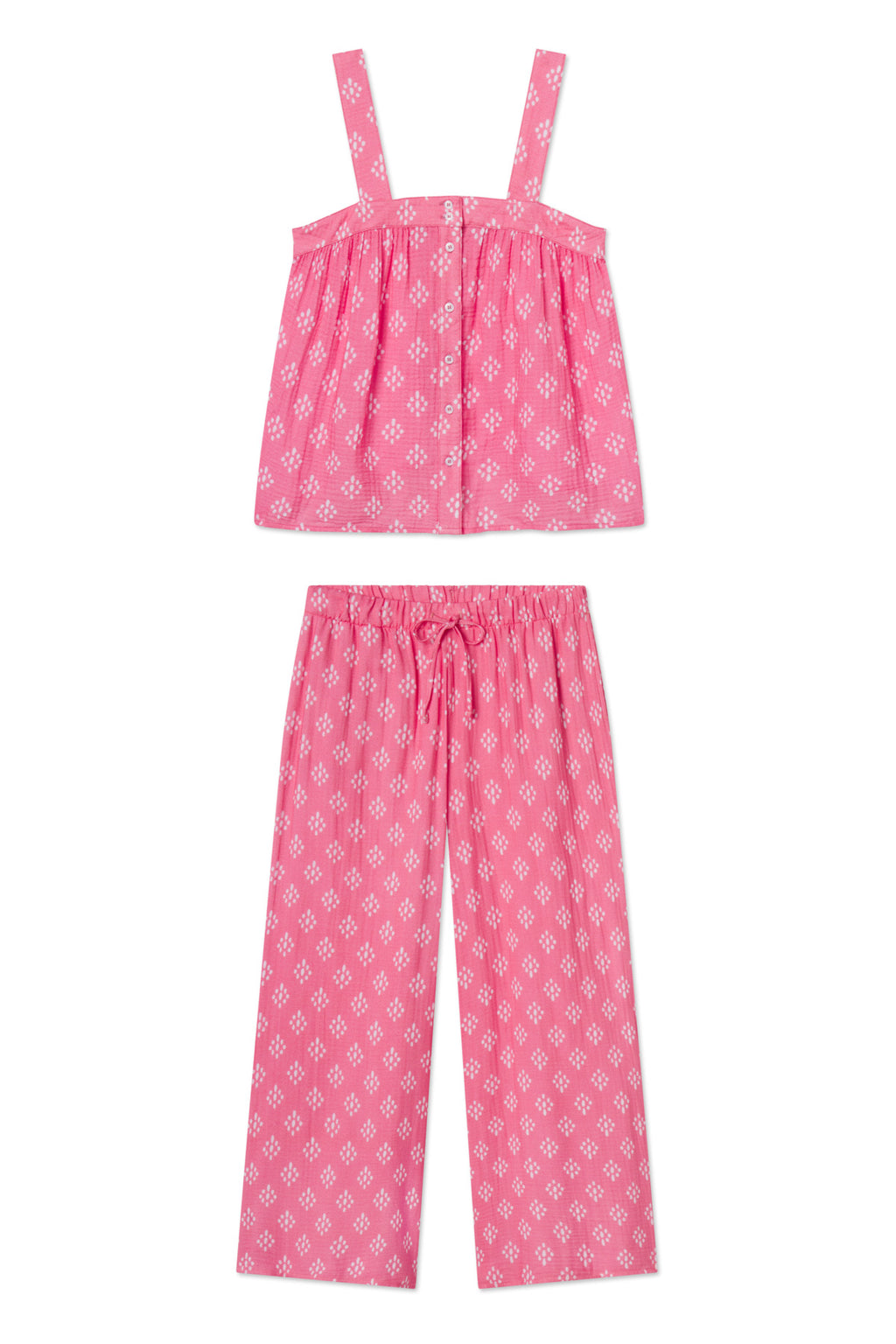 The Hamptons Pants Set in Sunkissed Coral Ikat is a two-piece pajama set with a sleeveless, square-neck top and loose, drawstring pants—ideal for hot sleepers.