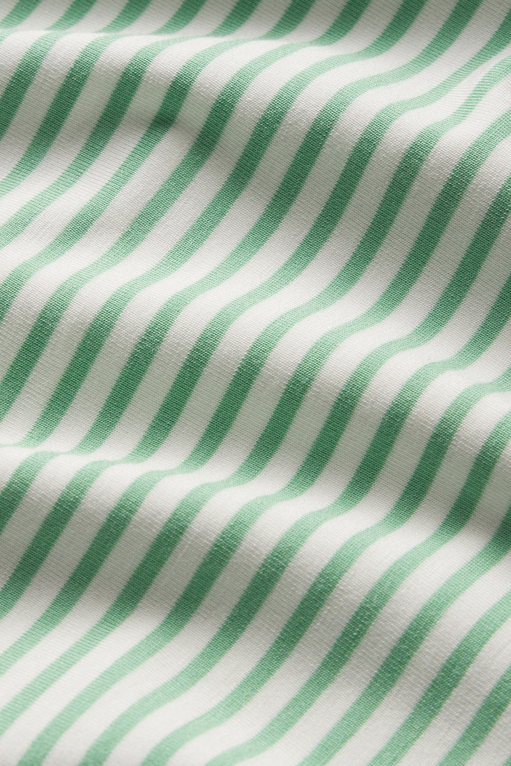 Close-up of the DreamModal Kimono Robe in Clover Leaf Pencil Stripe, showcasing its soft modal fabric with evenly spaced green and white stripes, gentle folds, subtle shadows, and a refined texture perfect for a kimono robe.