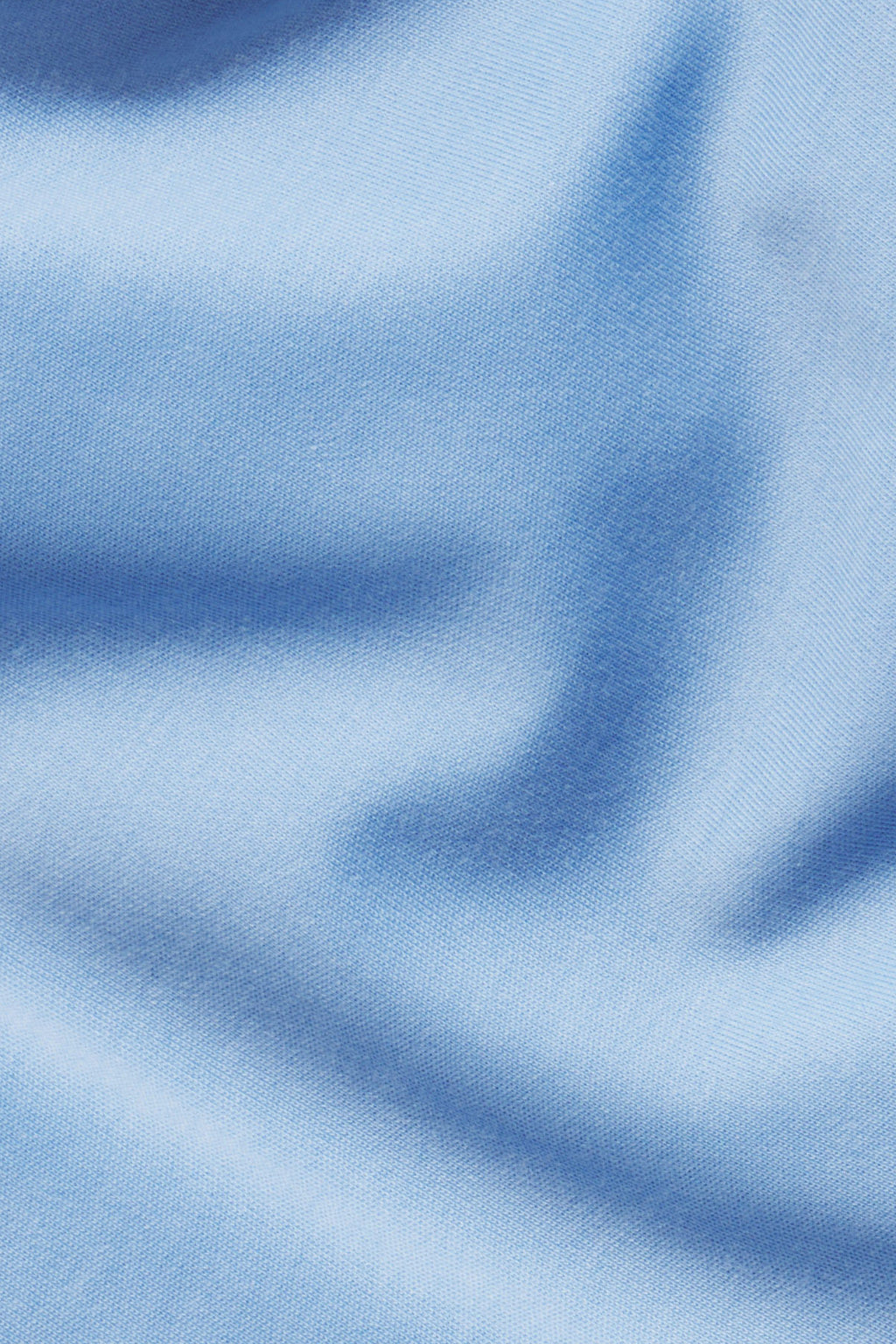 Close-up of Baltic Blue fabric with soft folds, creating gentle shadows and highlights across the smooth surface—perfect for the Relax Shorts Set in Baltic Blue.