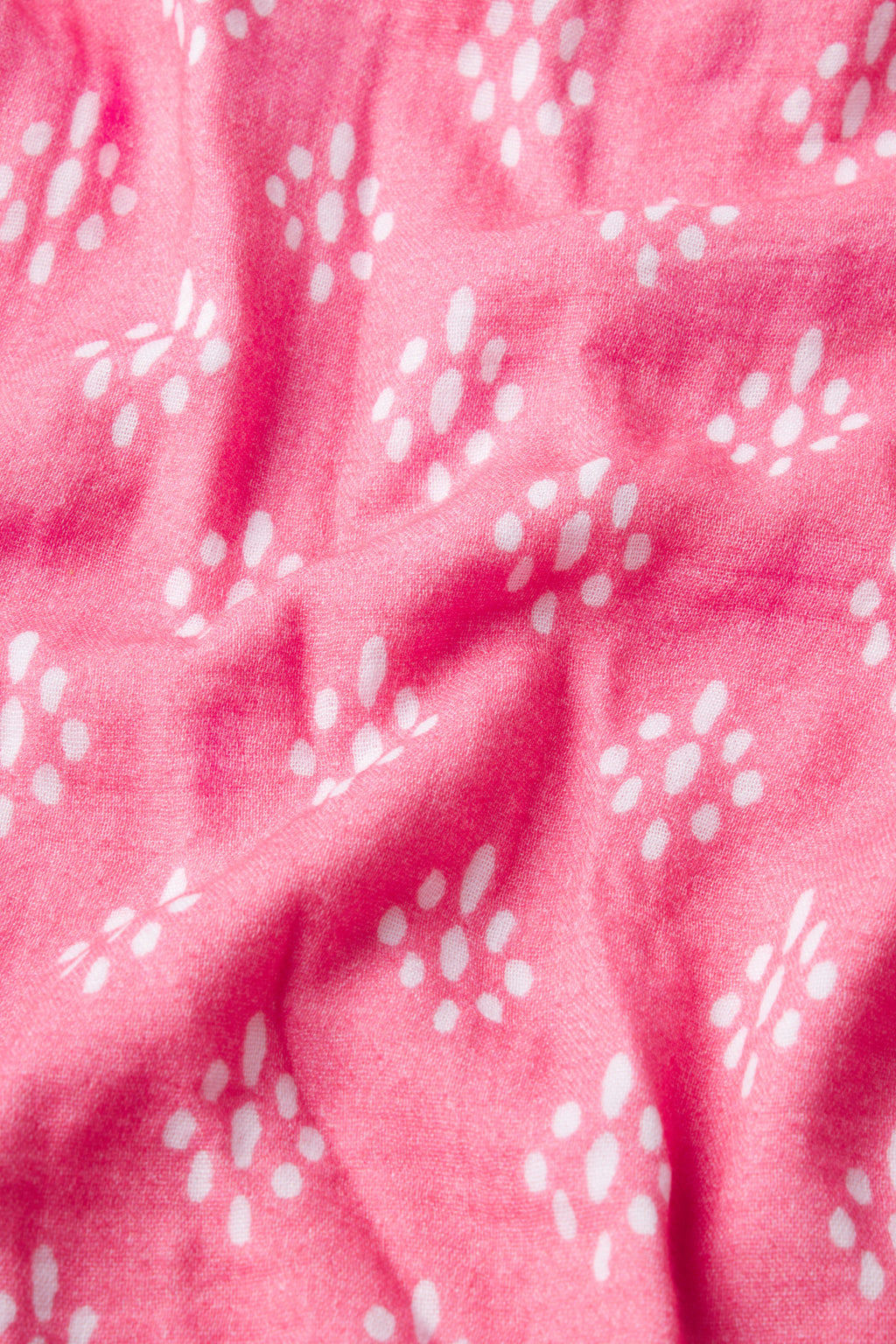 The Hamptons Pants Set in Sunkissed Coral Ikat features soft fabric with gentle folds and a textured look—perfect for hot sleepers seeking comfort and style.