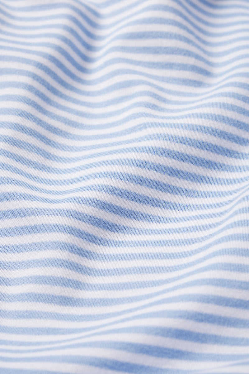 Close-up of light blue and white stripes on soft Pima cotton fabric, featured in the Baby Sleeper in Hydrangea with a cozy feel and convenient dual zipper.