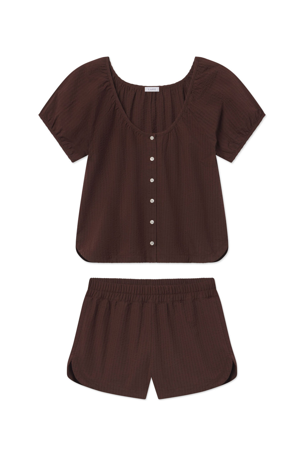 Brown seersucker shorts set with puffed-sleeve top and white button front.
