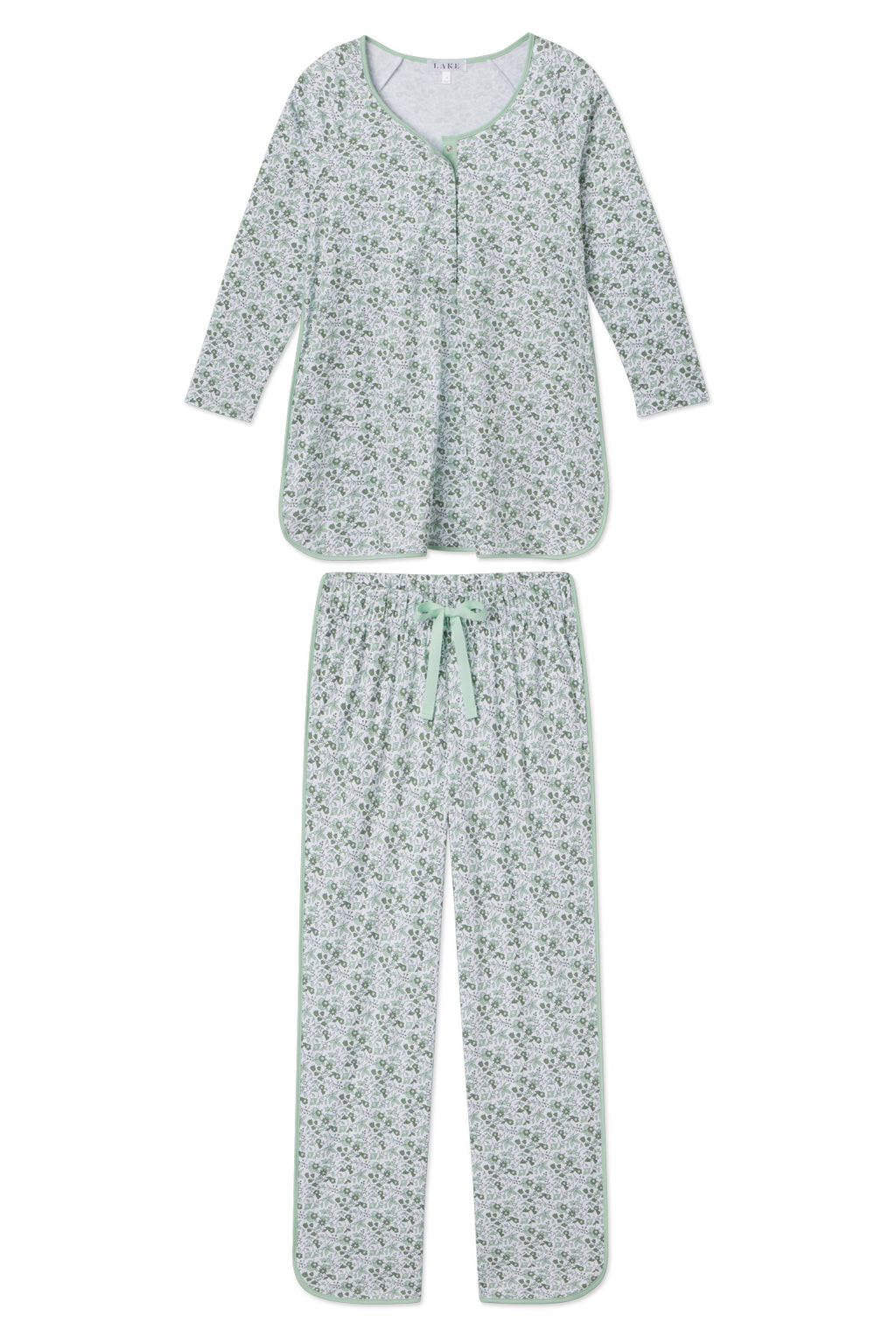 The Pima Maternity Long-Long Set in Topiary Garden Floral is a soft Pima cotton two-piece with a long-sleeve button-up top and matching pants, featuring a green and white floral print and light green trim. Ideal for maternity or nursing.