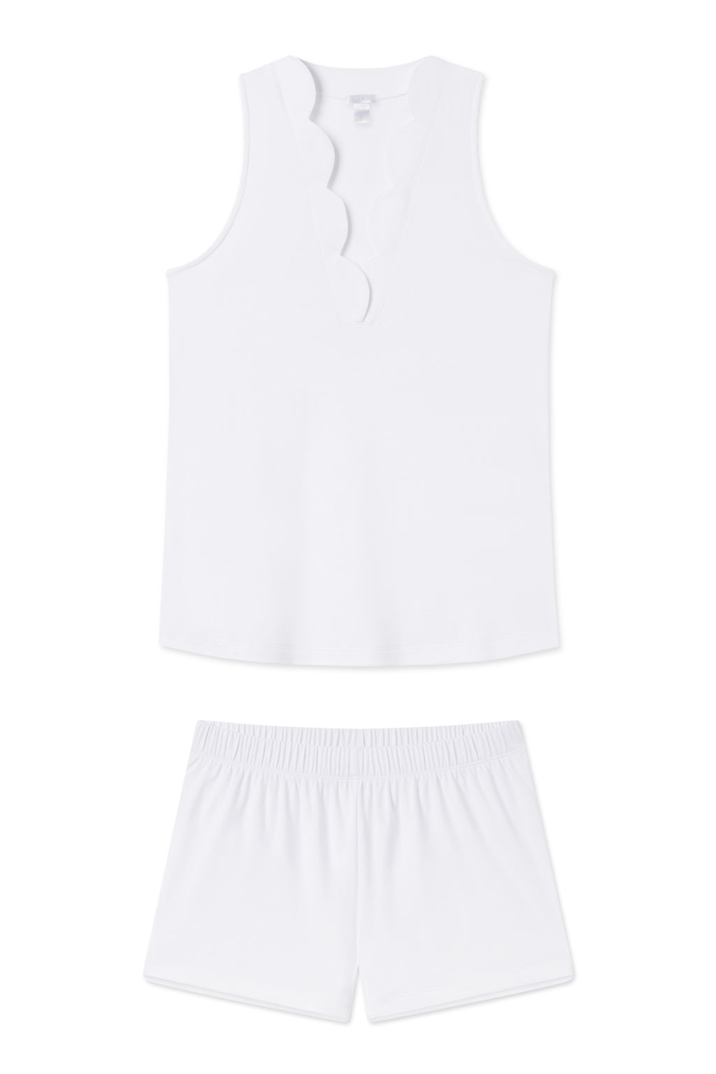 The Pima Scallop Shorts Set in White features a sleeveless pajama top with a scalloped neckline and matching elastic-waist shorts, all crafted from soft Peruvian Pima cotton and shown laid flat on a white background.