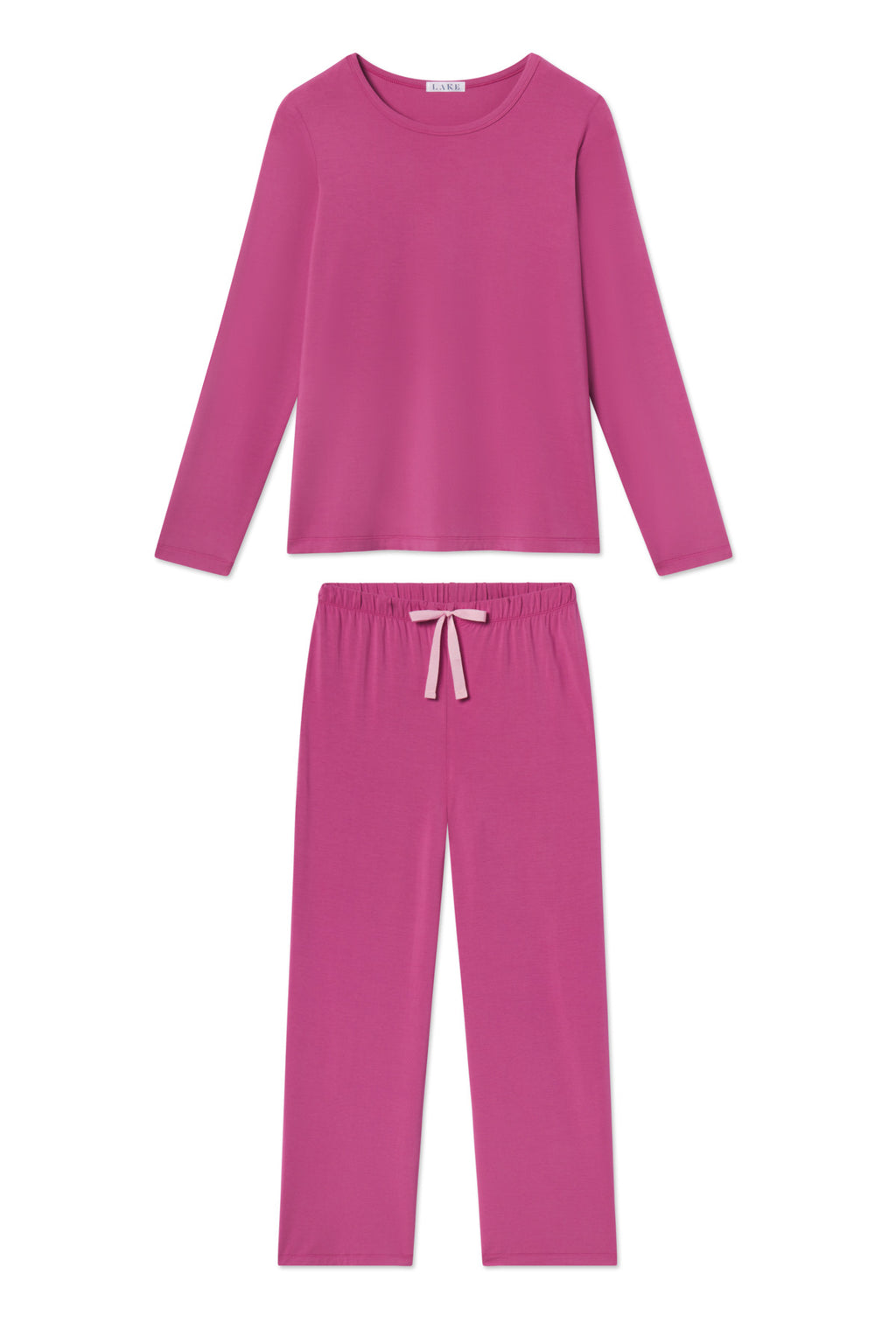 The DreamModal Ribbon Long-Long Set in Camellia is a bright pink sleepwear set with a long-sleeve crewneck top and loose modal pants featuring an elastic waistband and a small front bow.