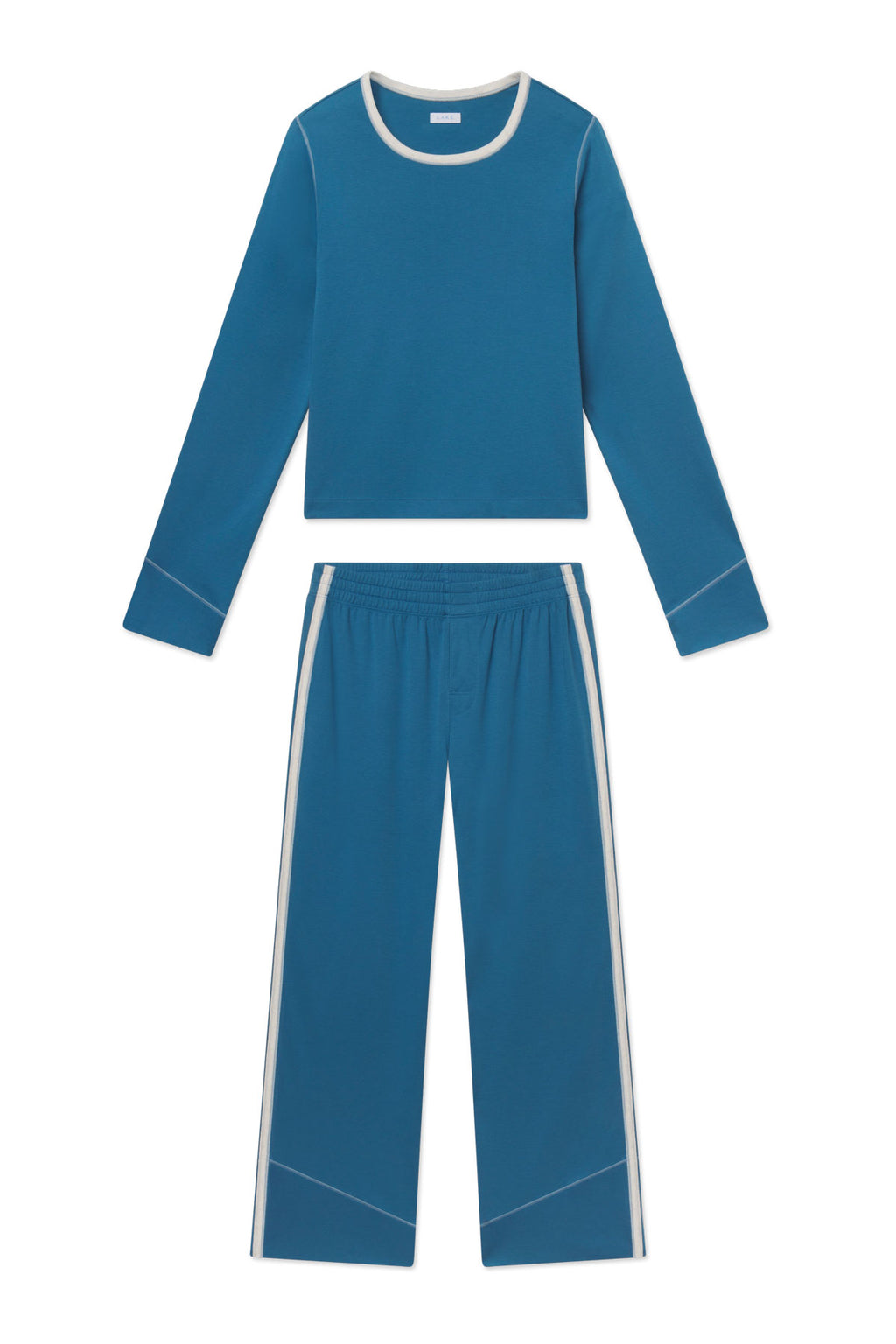 Blue two-piece set with long-sleeve crew neck top and wide-leg pants, both featuring cream-colored trim accents.