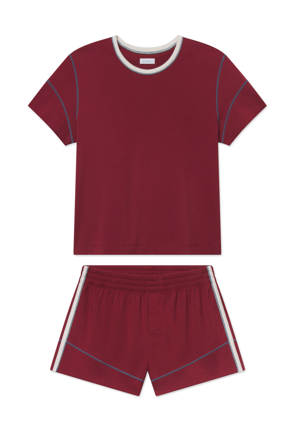 Burgundy knit shorts set with short-sleeve crew neck tee and contrasting blue seam details on both pieces.
