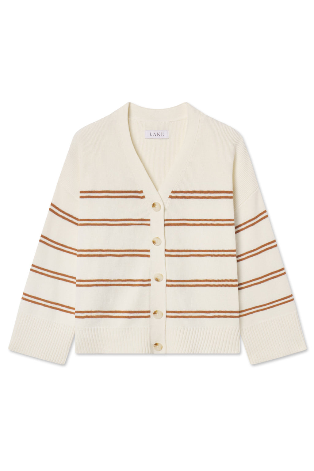 The Nora Cardigan in Oak Varsity Stripe features a cream base with brown stripes, a V-neckline, front buttons, long sleeves, ribbed cuffs and hem. This 100% cotton boxy varsity sweater is slightly cropped for a modern fit.