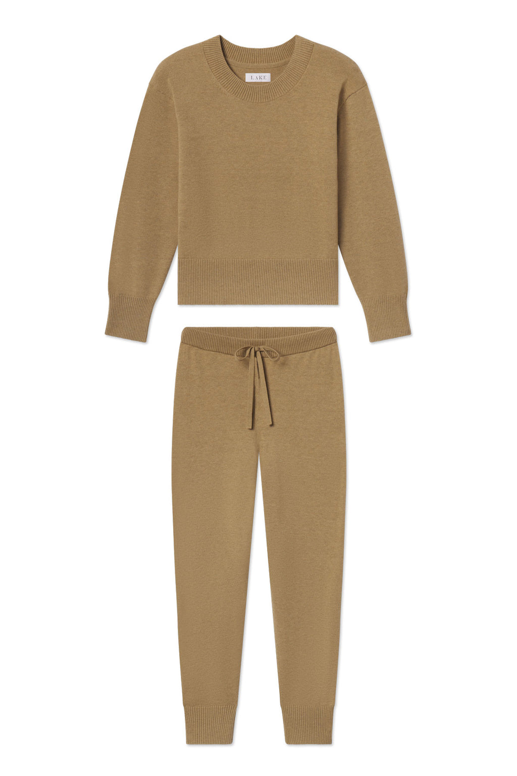 The Vesper Crew Neck Set in Sandstone Heather includes a matching knit lounge set with a cropped crewneck sweater and jogger-style pants, both featuring ribbed cuffs and hems.