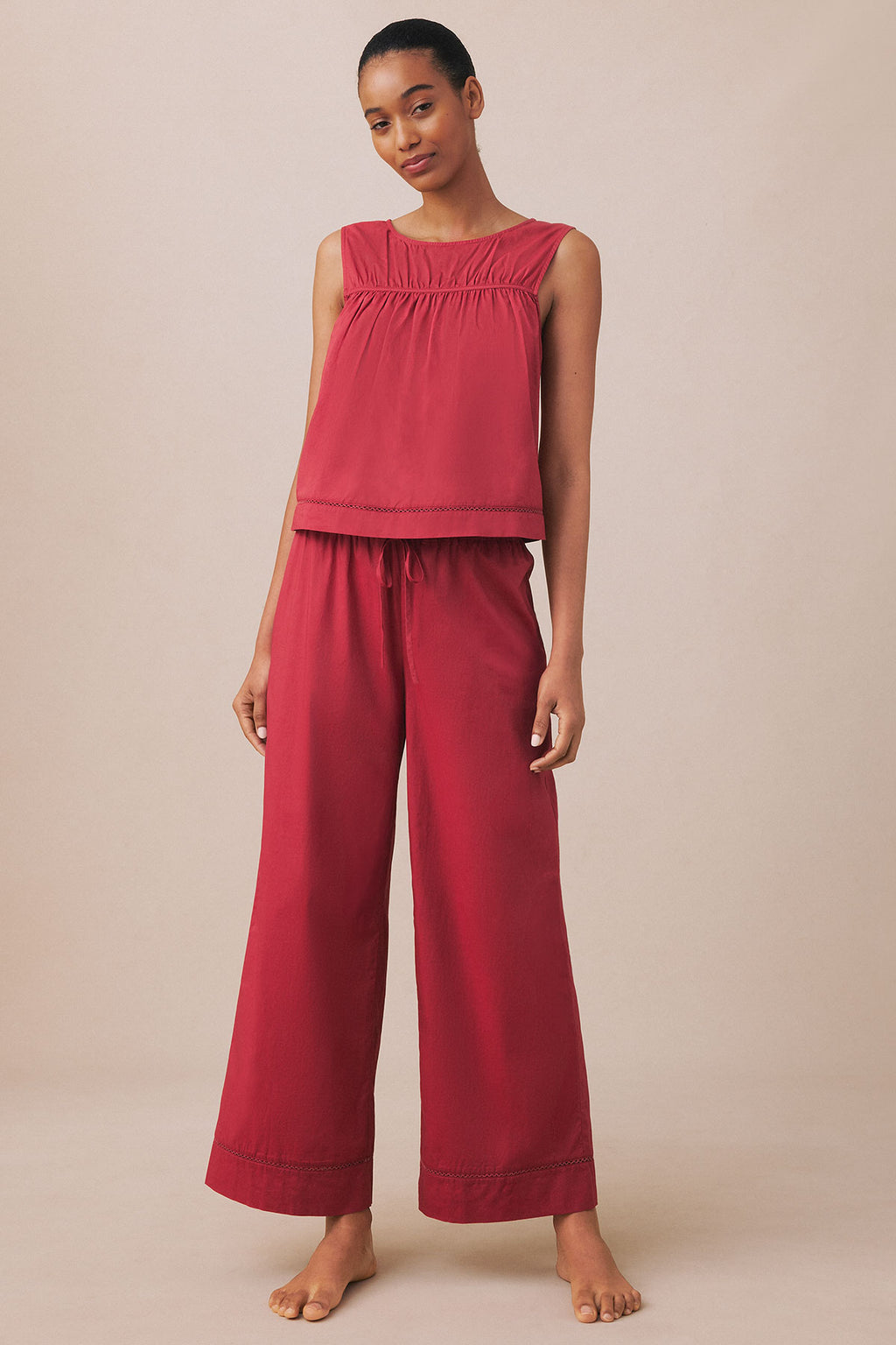 Burgundy sleeveless tank top with gathered neckline and matching wide-leg pants with drawstring waist.