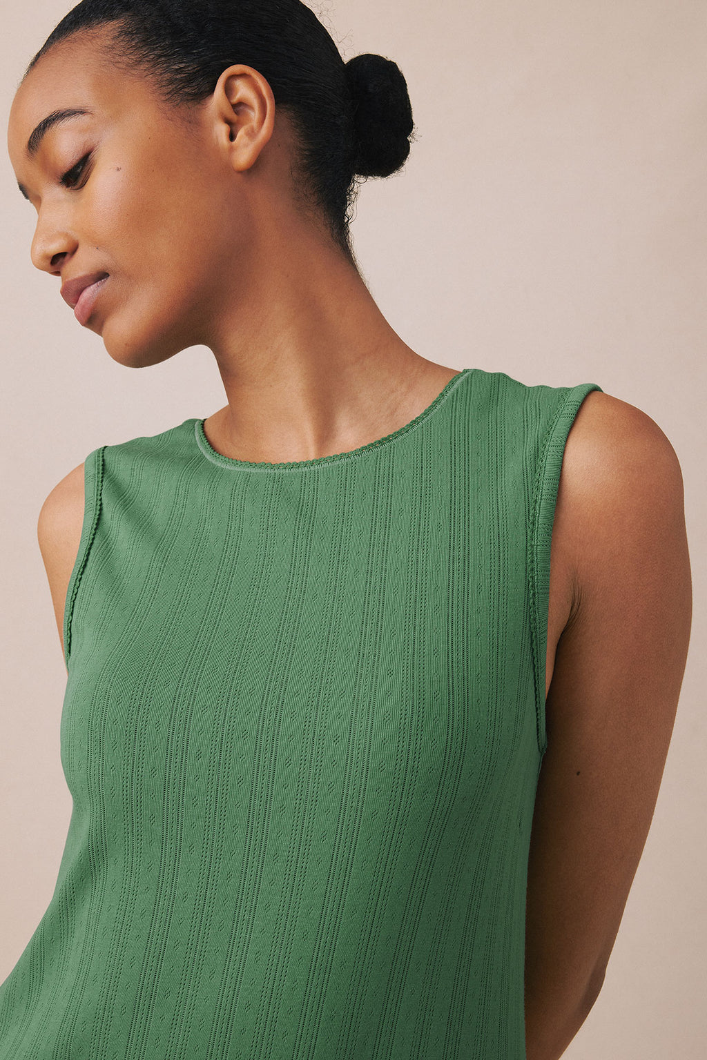 Sage green sleeveless tank gown with textured pointelle knit fabric and crew neckline.