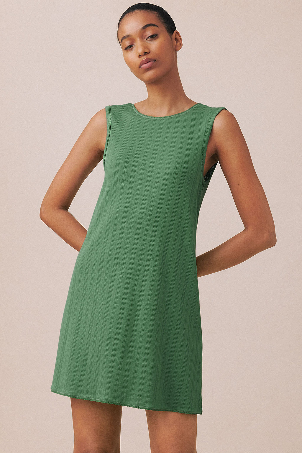 Green pointelle tank gown with crew neckline and sleeveless design, shown on model.