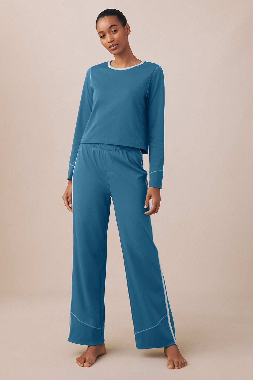 Blue long-sleeve top and matching wide-leg pants with contrasting trim, shown on model.
