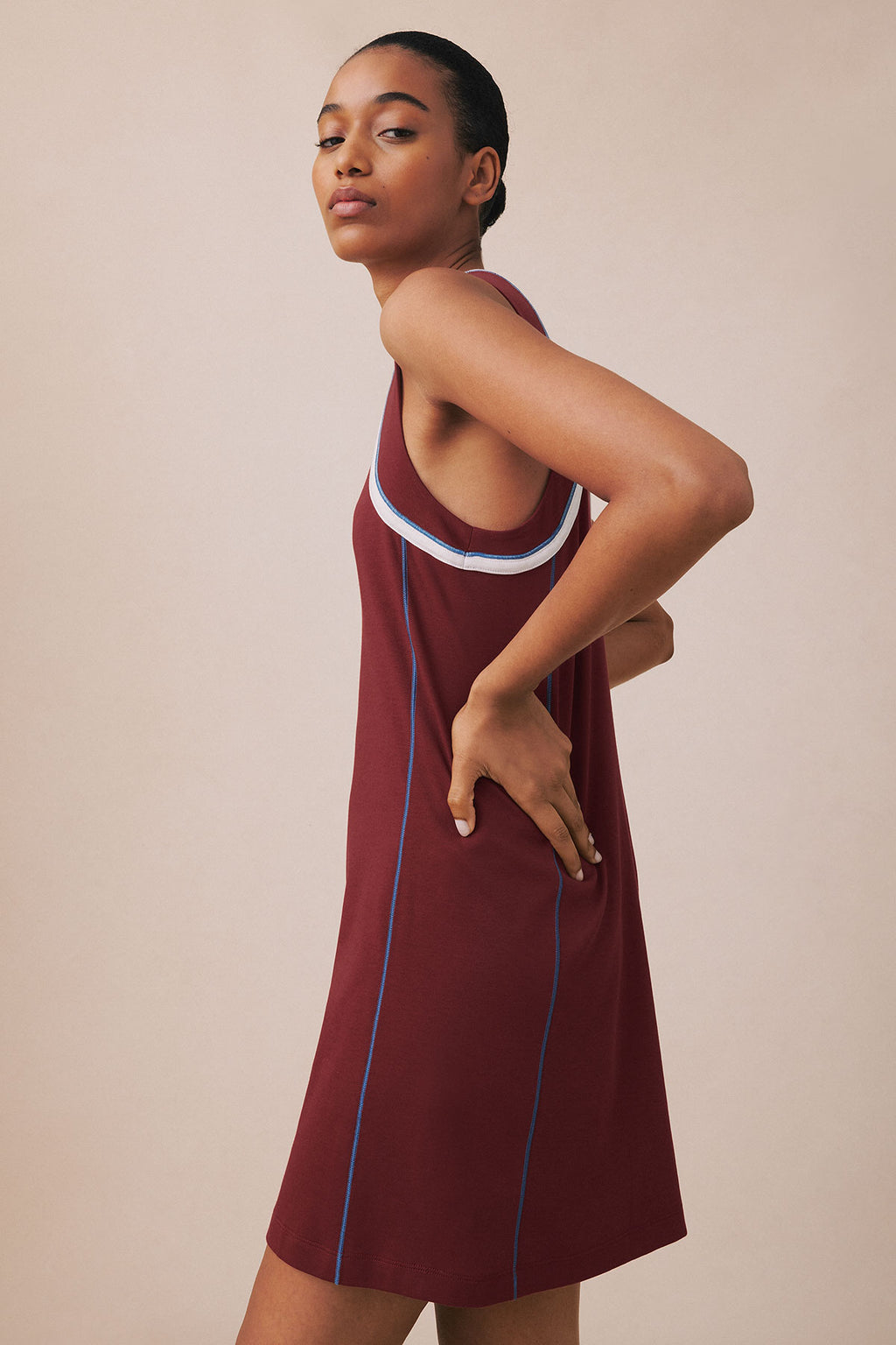 Syrah sleeveless tank gown with white and blue trim at neckline and blue side seams.