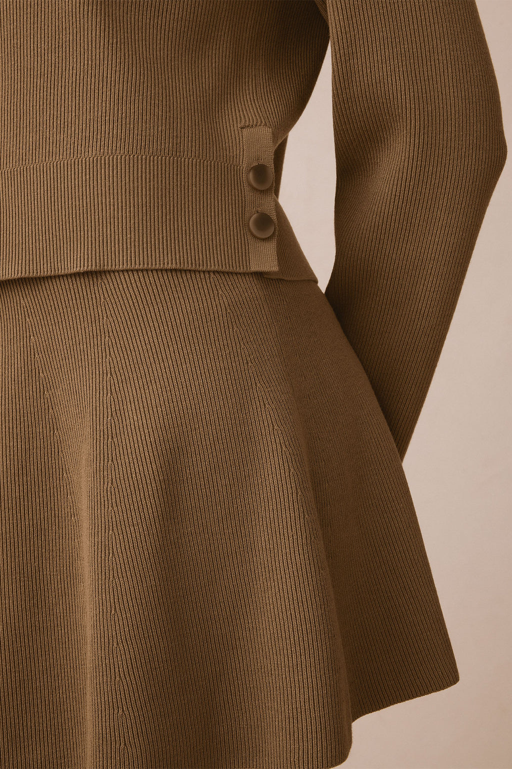 Toffee ribbed knit two-piece set with long-sleeve top featuring button side details and A-line skirt.