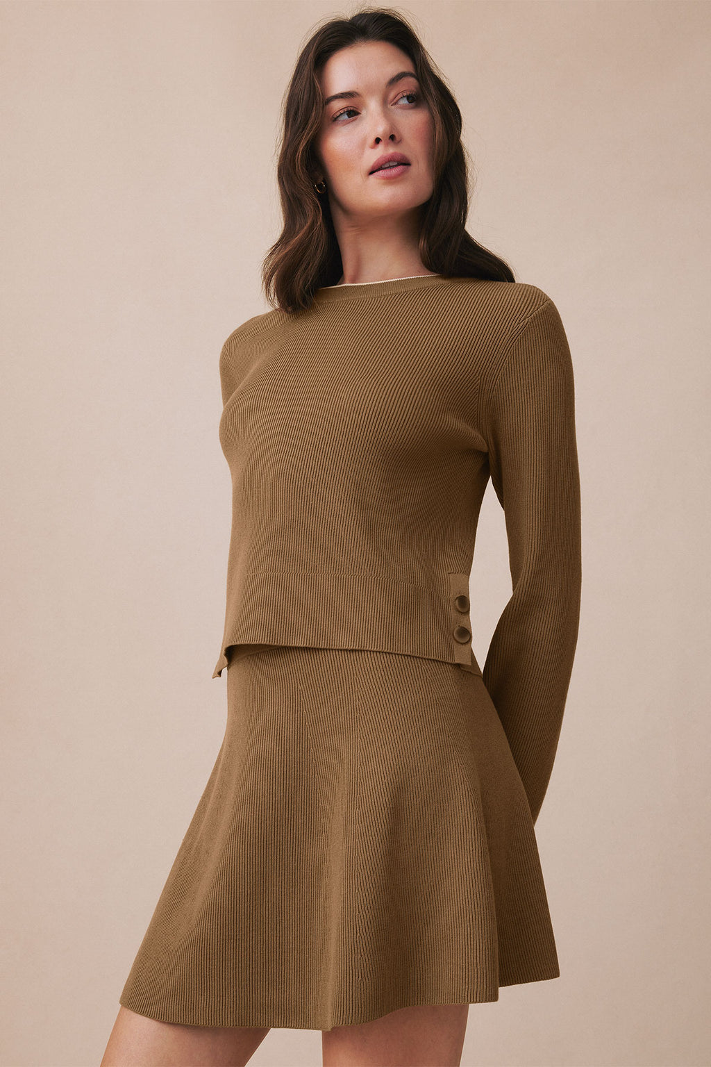 Toffee ribbed knit two-piece set with long-sleeve top featuring side buttons and A-line skirt.