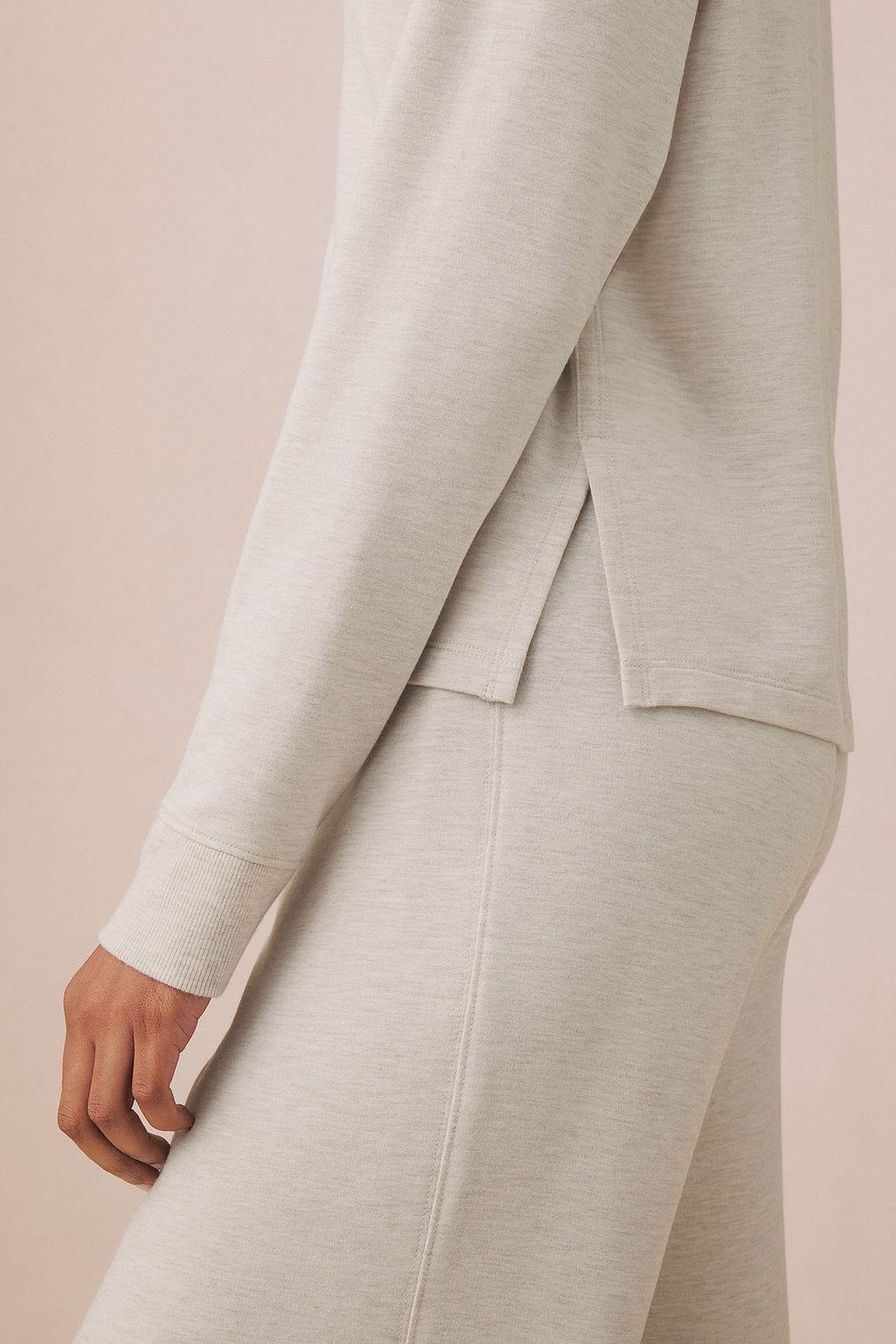 Oat heather V-neck long-sleeve top and matching pants with ribbed cuffs, shown on model from torso down.