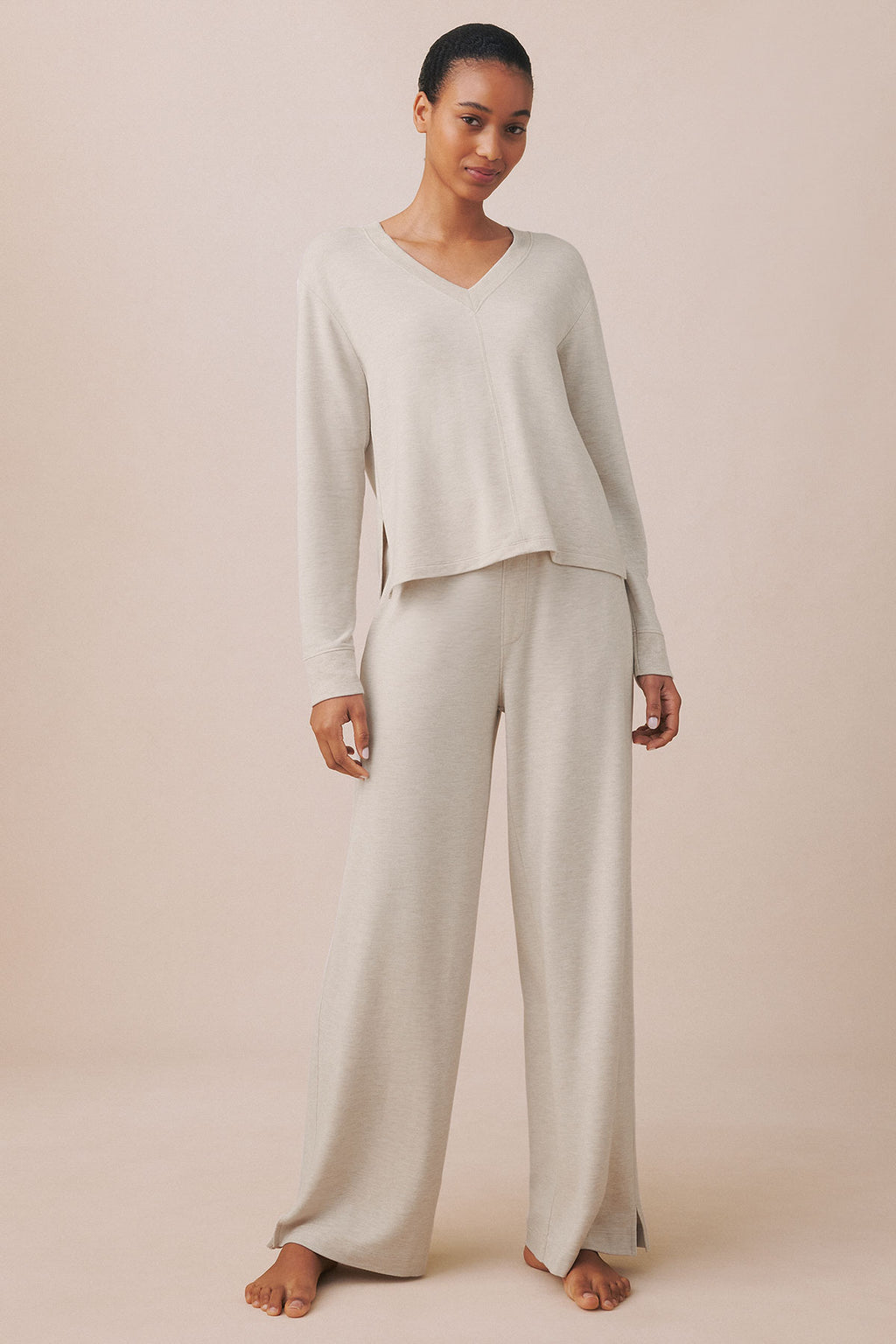 Woman wearing oat heather V-neck long-sleeve top and matching wide-leg pants.