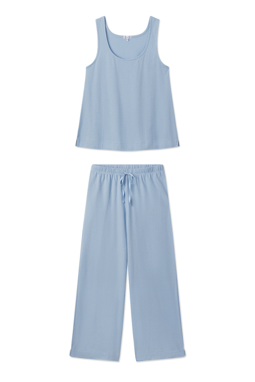 The Pointelle Pajama Pants Set in French Blue Solid includes a sleeveless scoop-neck top and loose drawstring pants, both made from soft, lightweight knit. The set is shown laid flat on a white background.