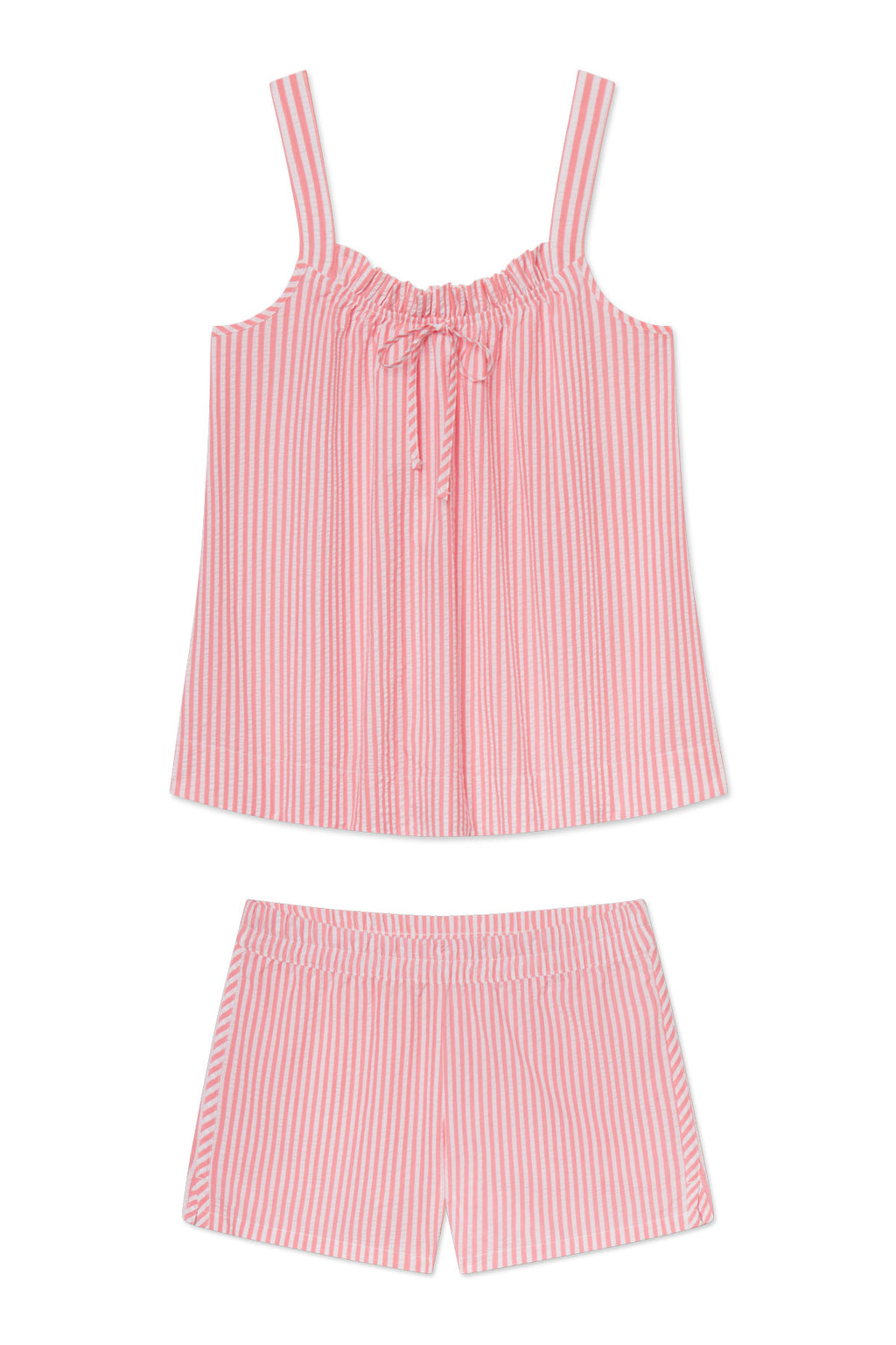 The Alice Shorts Set in Gelato Seersucker is a two-piece pajama set featuring a sleeveless top with shoulder straps and a neckline bow, paired with matching shorts with an elastic waistband.