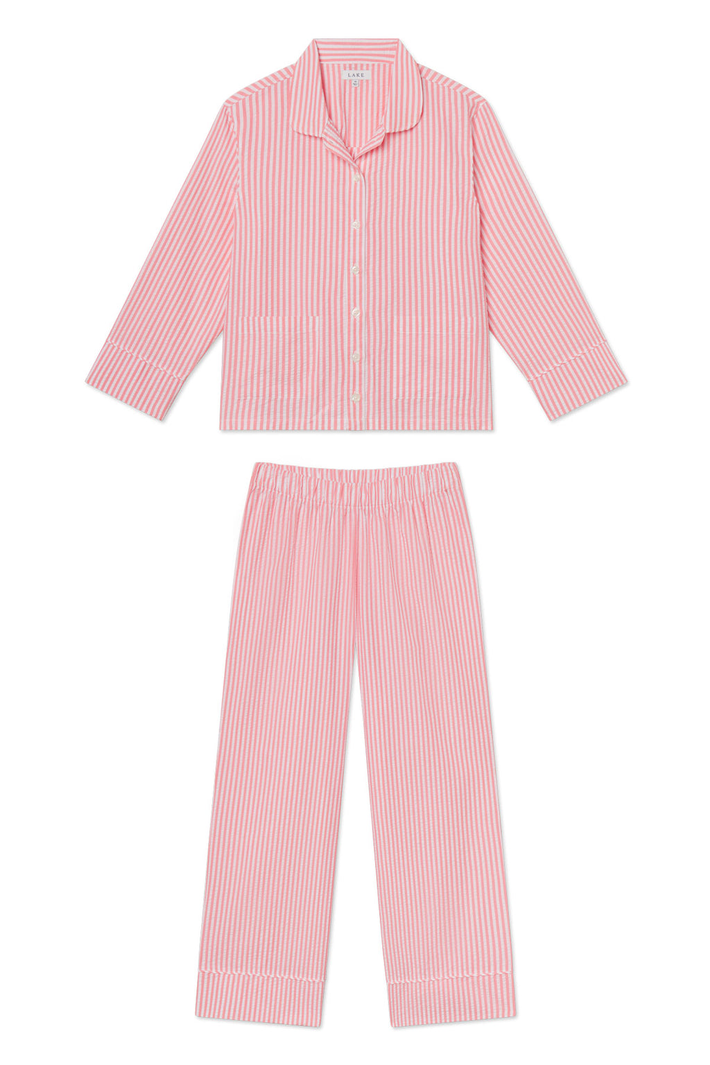The Georgie Pocket Pants Set in Gelato Seersucker features pink and white vertically striped pajamas in ultra-soft Pima cotton, with a collared, pocketed button-up top and elastic-waist straight-leg pants.