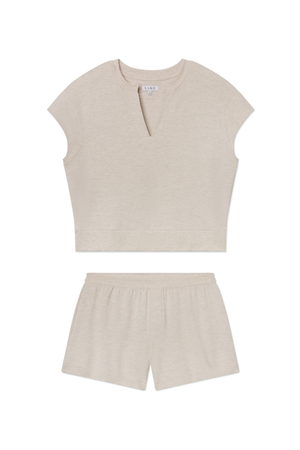 The Relax Short Sleeve Shorts Set in Oat Heather features a short-sleeve V-neck cropped top and relaxed-fit shorts with an elastic waistband, all crafted from soft modal spandex loungewear, shown on a white background.