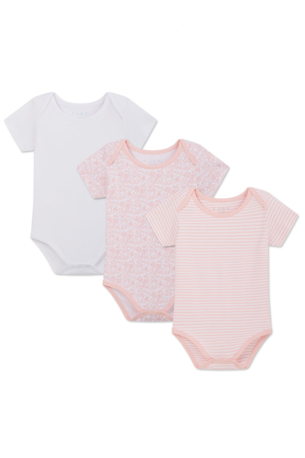 The Baby Bodysuit Bundle in English Rose includes three 100% Pima cotton bodysuits: plain white, light pink with a white floral English Rose print, and white with light pink stripes. Features envelope necklines and snap closures.