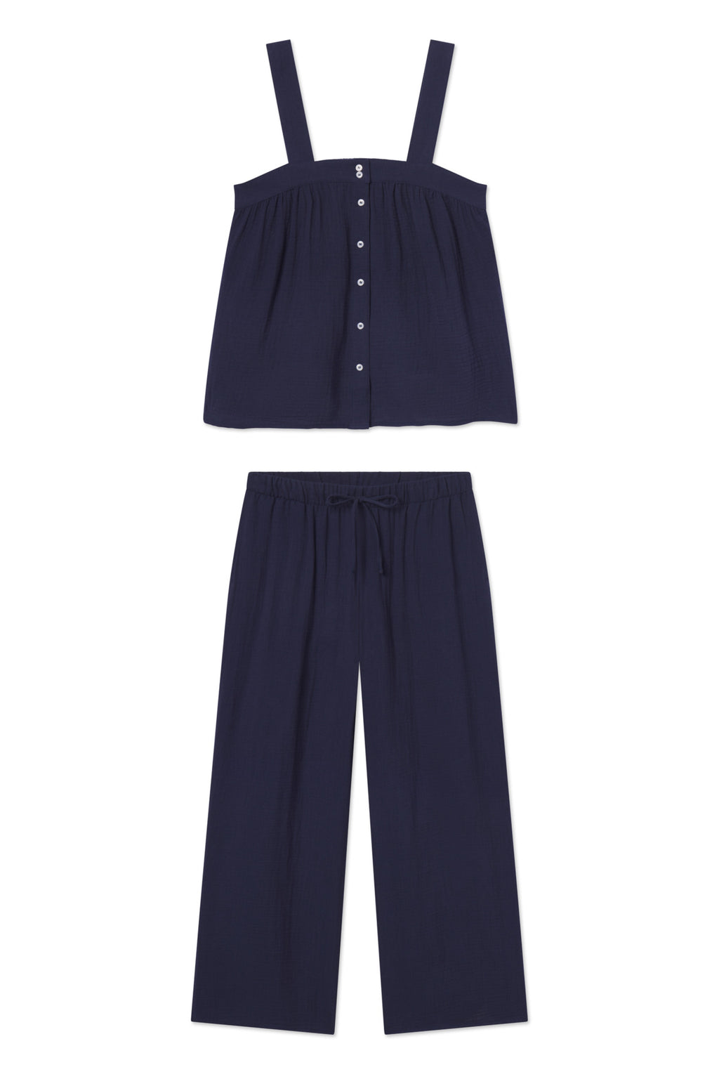 The Hamptons Pants Set in English Navy includes a navy, sleeveless button-front top with wide straps and matching wide-leg, drawstring pants made from lightweight gauze—perfect for hot sleepers. Shown on a white background.