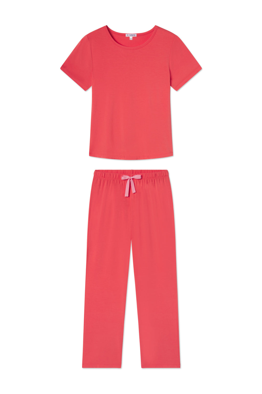 The DreamModal Ribbon Short-Long Set in Terrace features a terracotta coral pink short-sleeve top and long pants with an elastic waistband and ribbon tie, crafted from soft modal. Both pieces are shown laid flat on a white background.