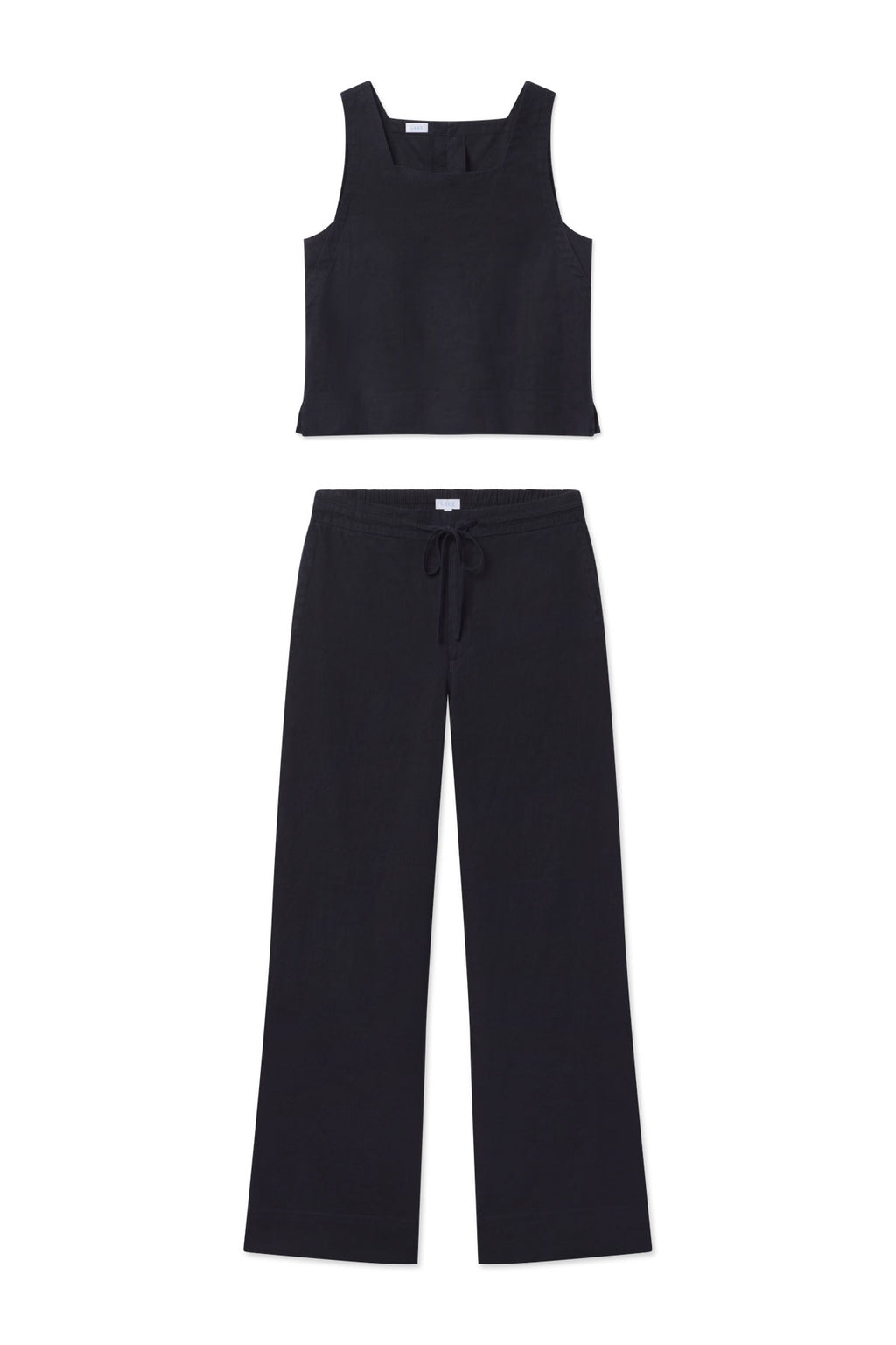 The Coupe Pant Set in Black features a sleeveless top with a square neckline and high-waisted, wide-leg drawstring pants, shown laid flat on a white background.