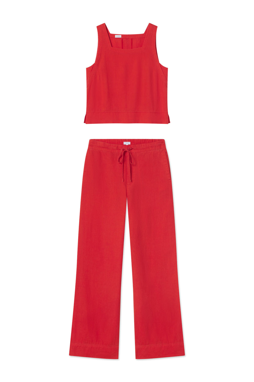 The Coupe Pant Set in Tart features a matching red linen sleeveless crop top with wide straps and high-waisted, wide-leg pants with a drawstring waist, shown on a white background—perfect for warm-weather occasions.