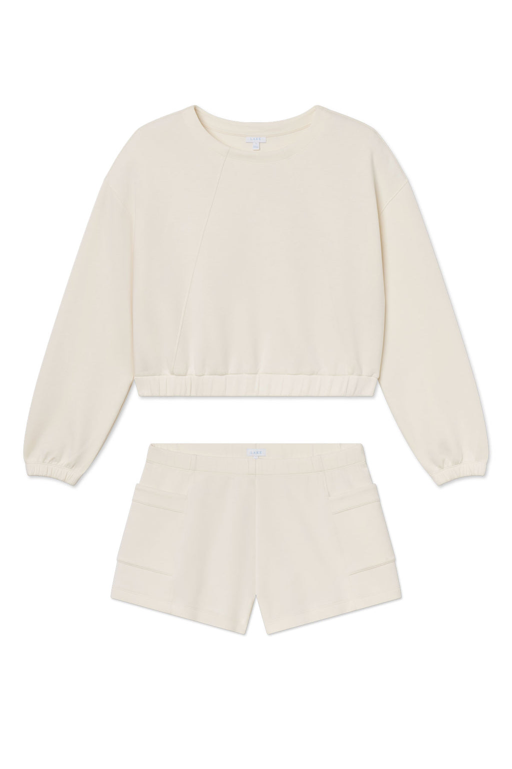The Dash Short Set in Parchment features a cream-toned spacer knit with an oversized crew-neck pullover and matching high-waisted shorts with side pockets, shown on a white background.