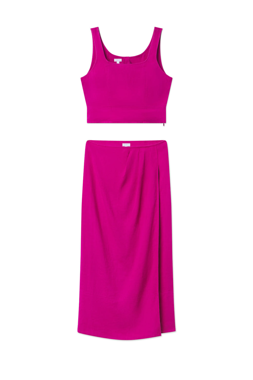 The Flute Skirt Set in Fuchsia features a sleeveless crop top and matching high-waisted, mid-length skirt with a tailored fit, shown flat on a white background.
