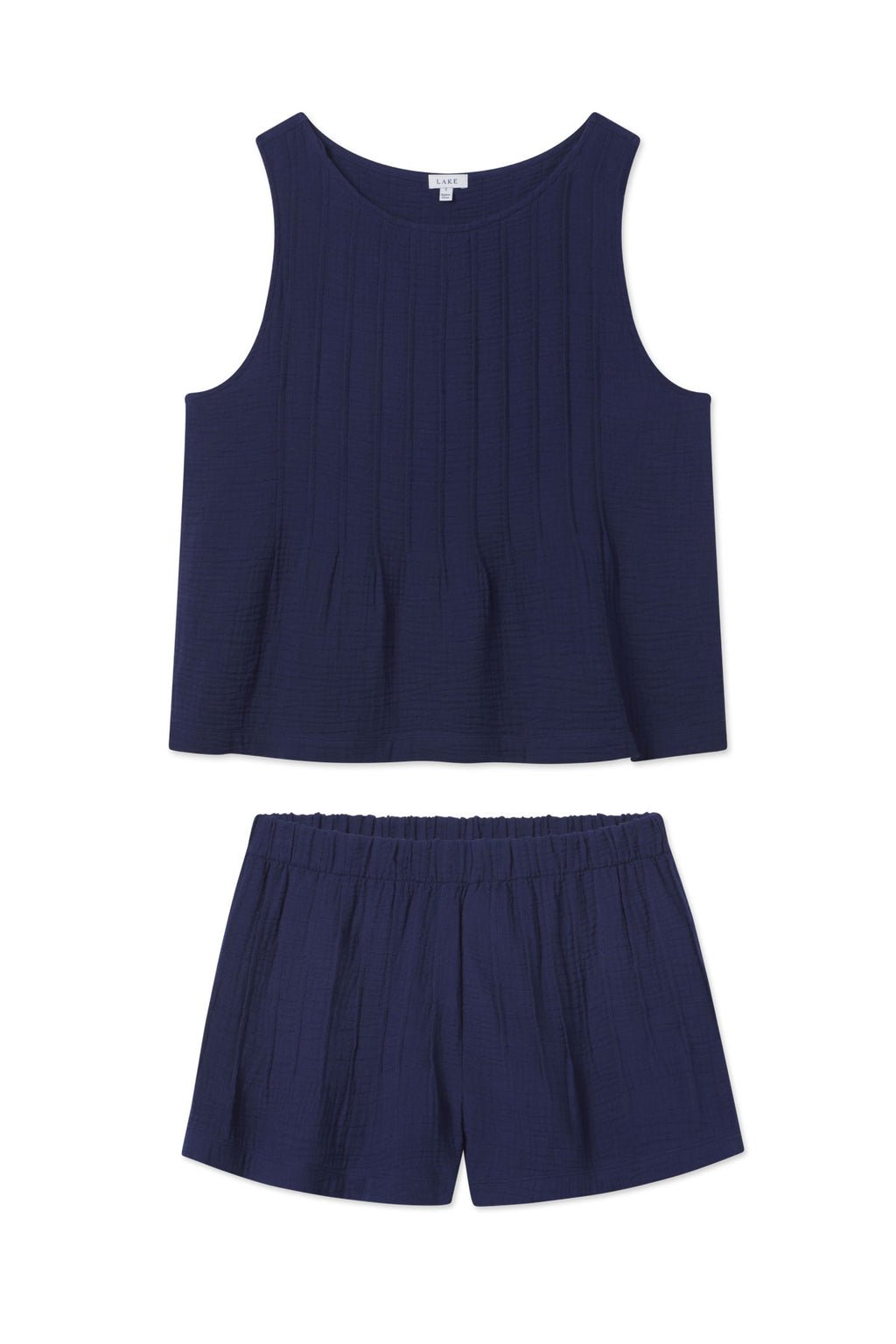 The Monaco Shorts Set in Blue Depths Gauze includes a sleeveless tank top and elastic-waistband shorts, both made from soft cotton gauze and shown flat on a white background.