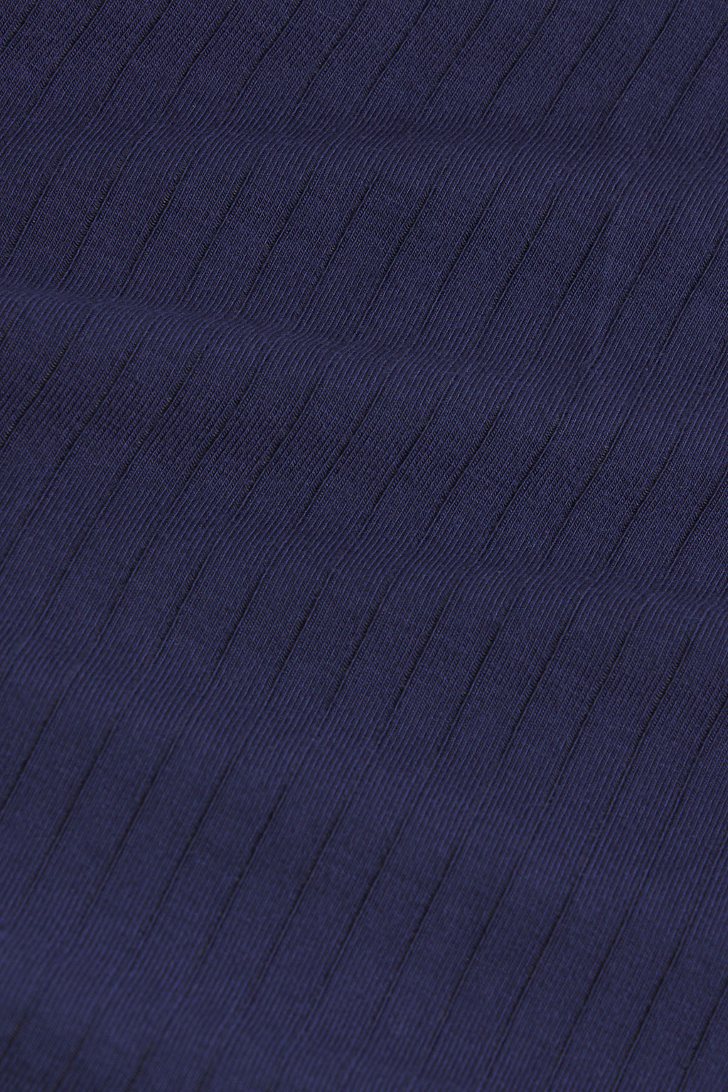 Dark navy ribbed fabric with diagonal texture pattern.