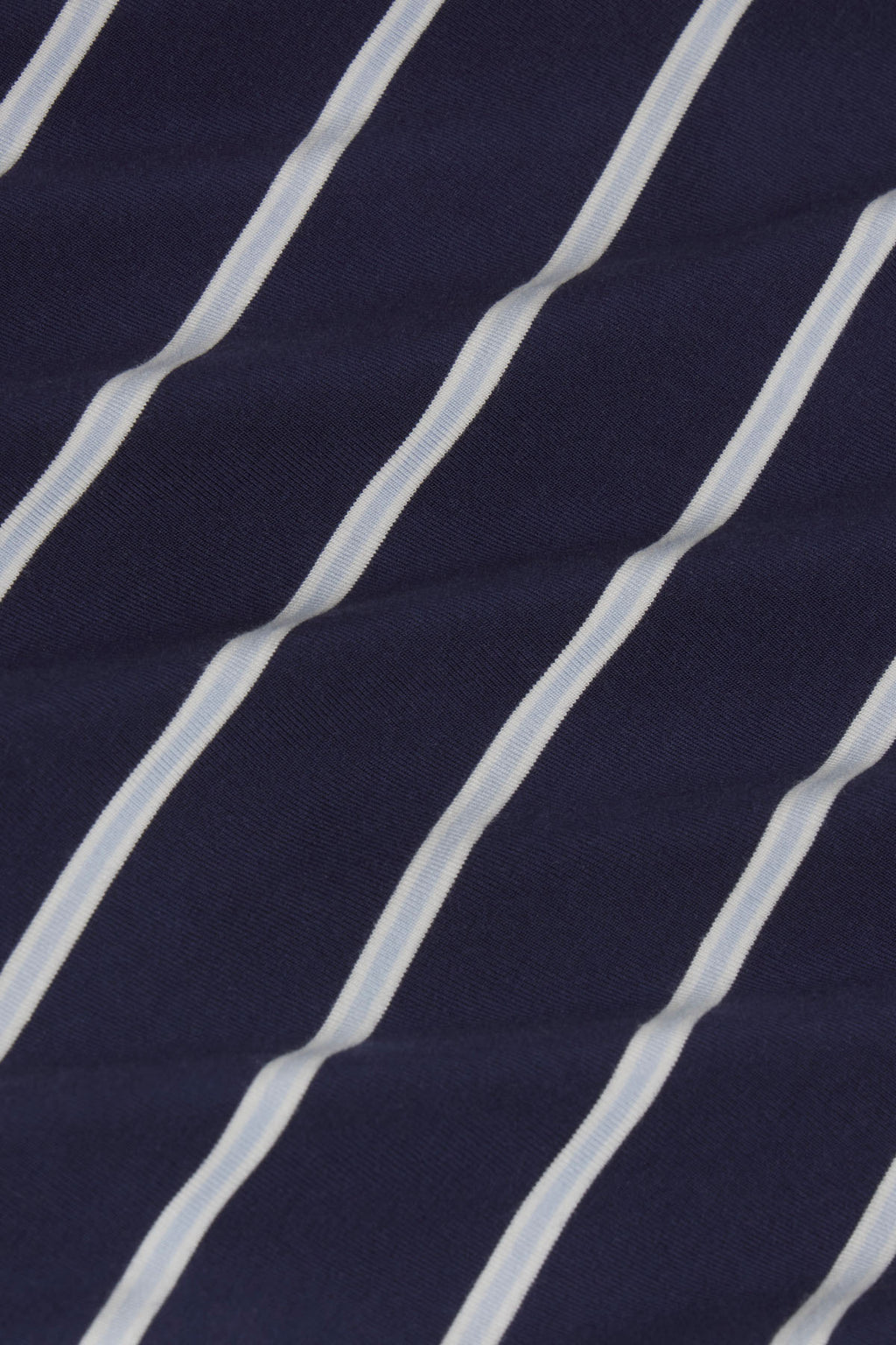 Navy fabric with diagonal white stripe pattern.