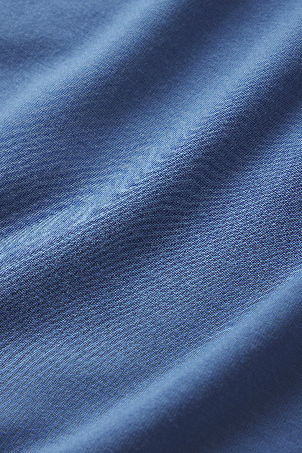 A close-up view of the soft, smooth blue fabric in the DreamModal Ribbon Long-Long Set in Seaport, featuring gentle folds—perfect for comfortable modal sleepwear.