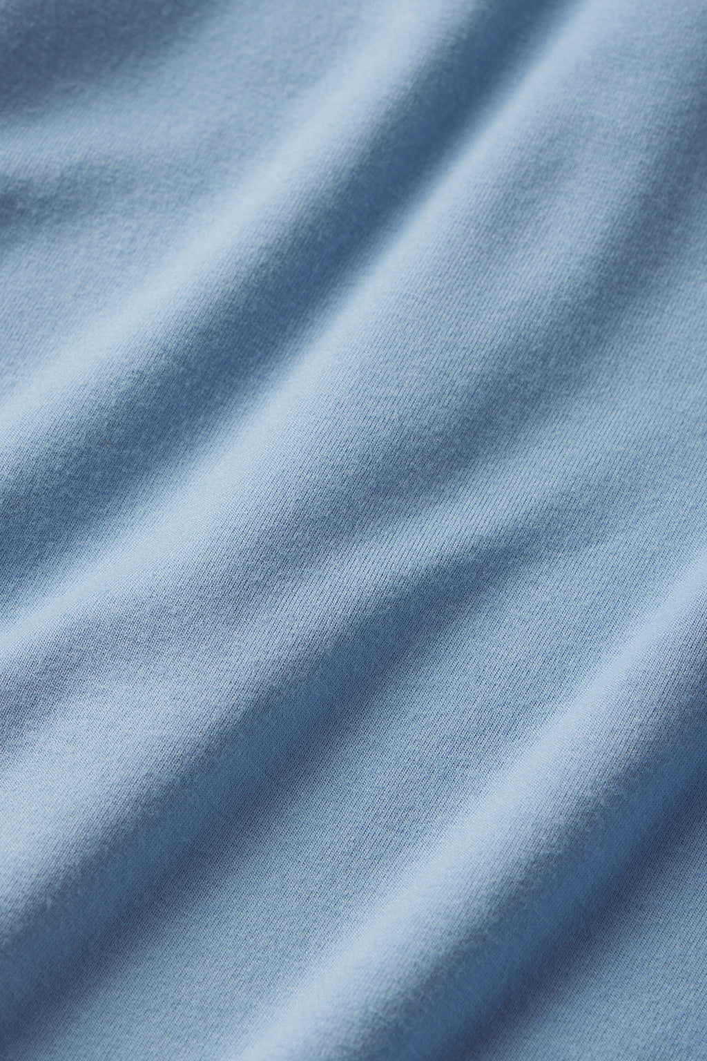Close-up of the DreamModal Cami Nightgown in Serene Blue, featuring gentle fabric folds and a soft, smooth texture.