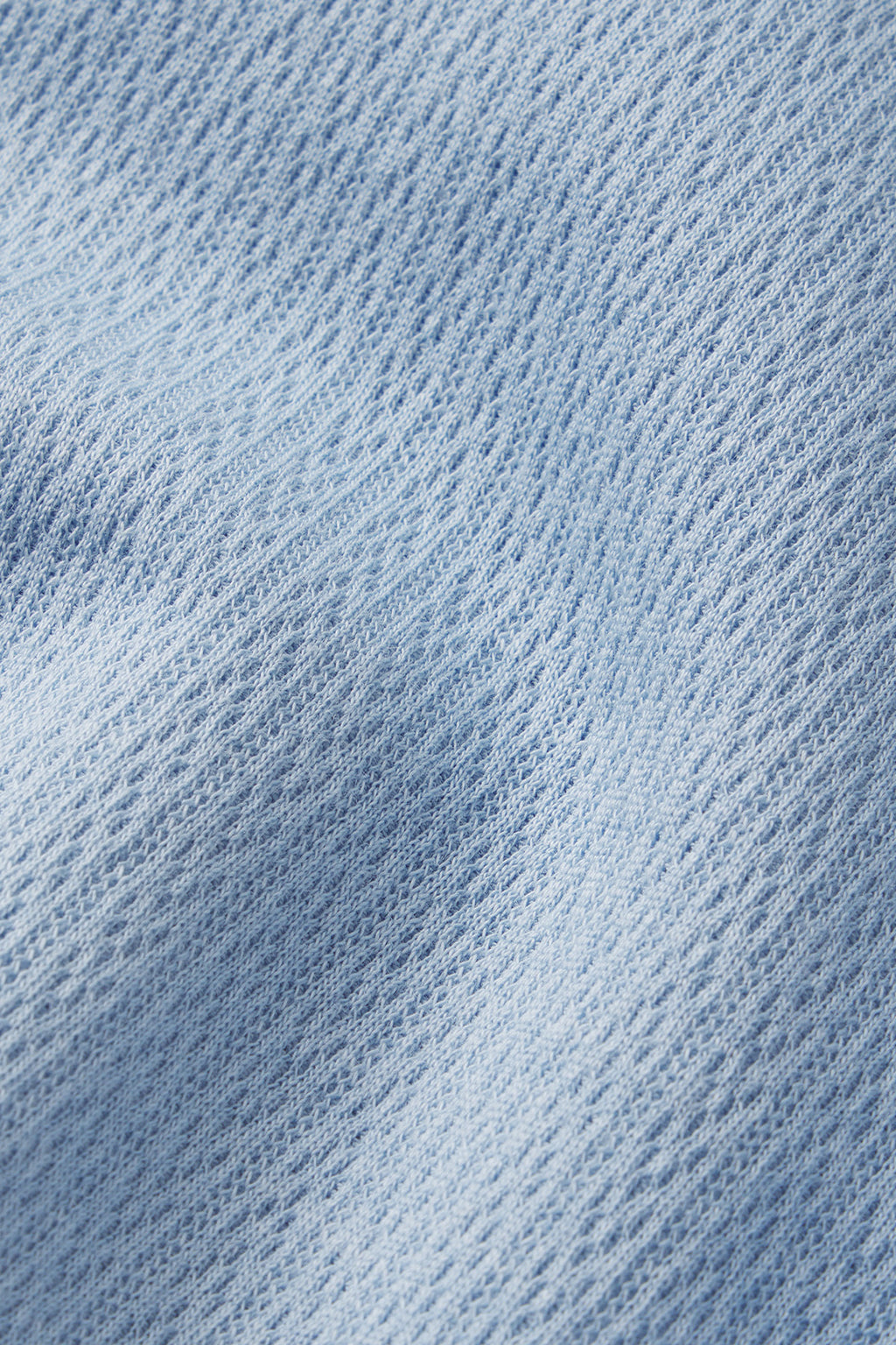 Close-up of the Pointelle Pajama Pants Set in French Blue Solid, featuring textured weave and soft folds that highlight its gentle, knit-like appearance—perfect for comfortable lounging.