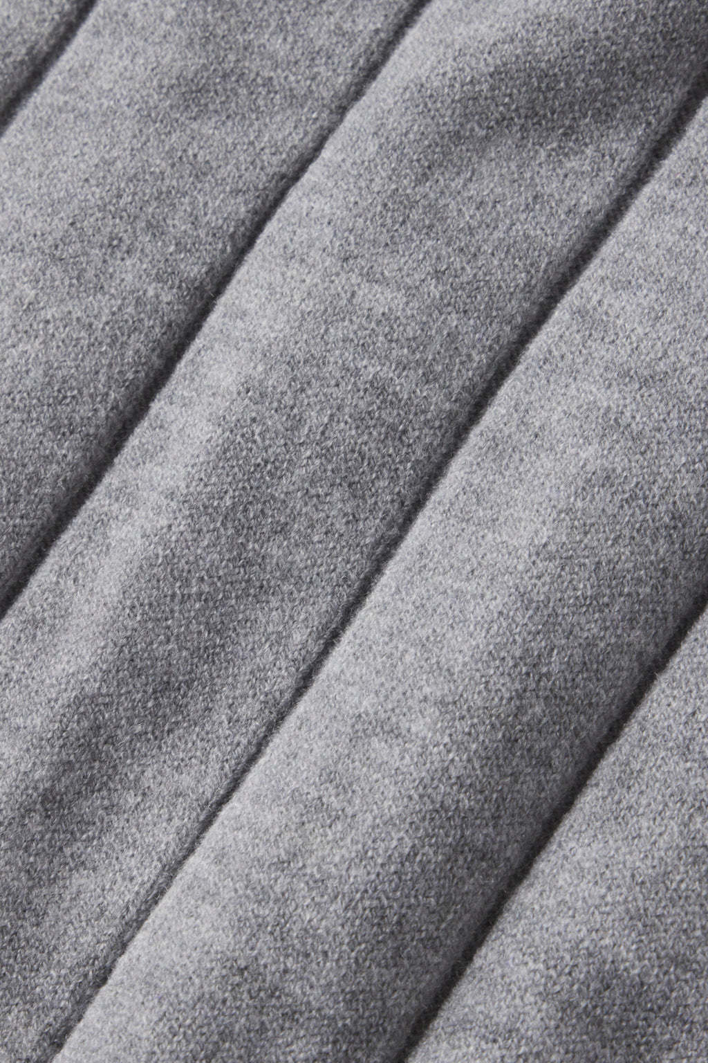 Close-up of soft Gainsboro Gray quilted fabric with evenly spaced vertical seams and a slightly fuzzy texture, similar to the cozy Vesper Jogger Set in Gainsboro Gray.