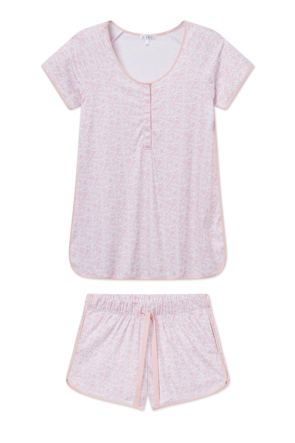 The Pima Maternity Shorts Set in English Rose Garden Floral features a light pink, short-sleeve pajama top with a round neckline and matching shorts with an elastic waistband and drawstring, adorned in a subtle floral pattern.