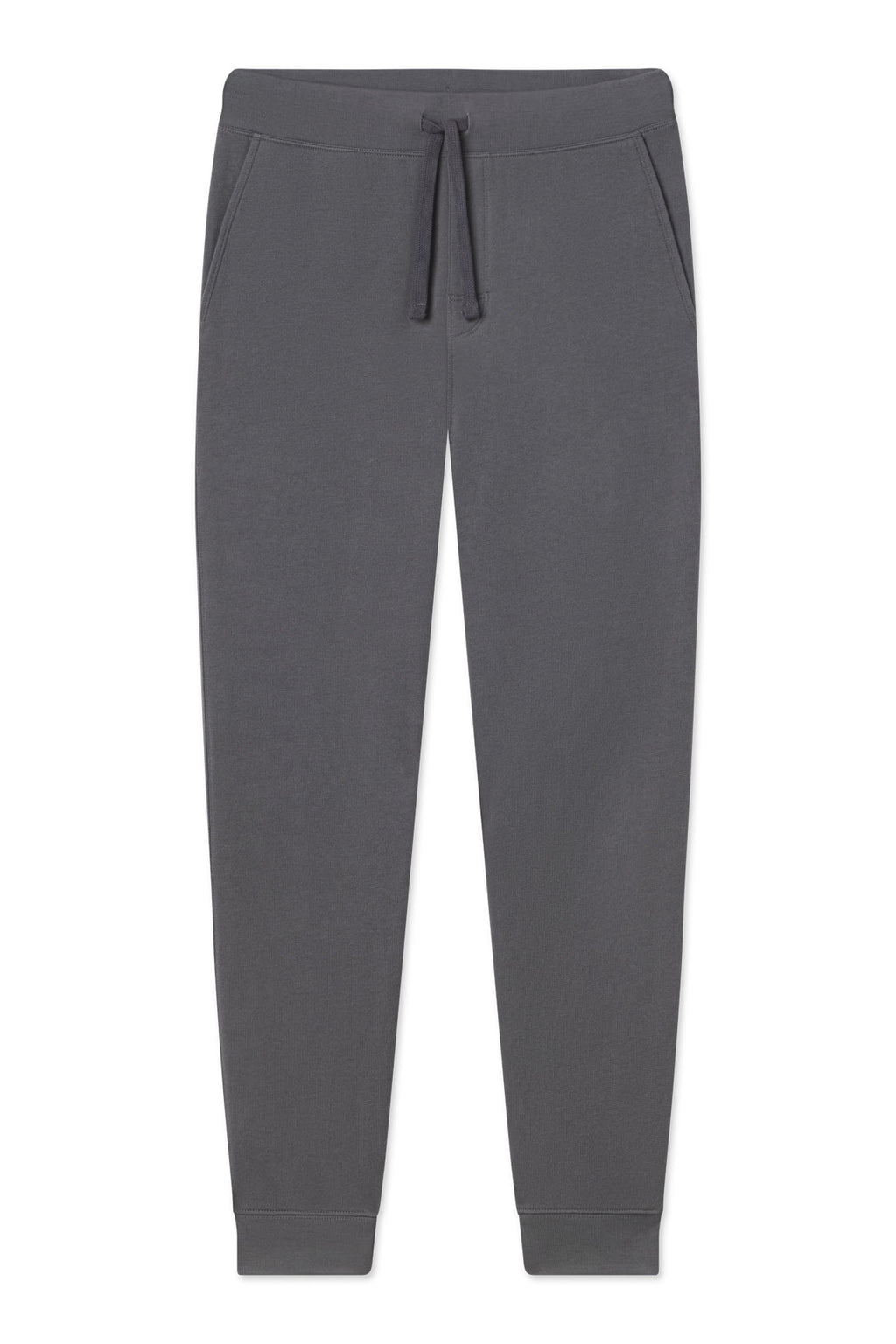 The Mens Dockside Jogger in Graphite features an elastic waistband with a drawstring, side pockets, and fitted cuffs. Made from soft cotton French Terry, these dark grey sweatpants are shown on a white background.