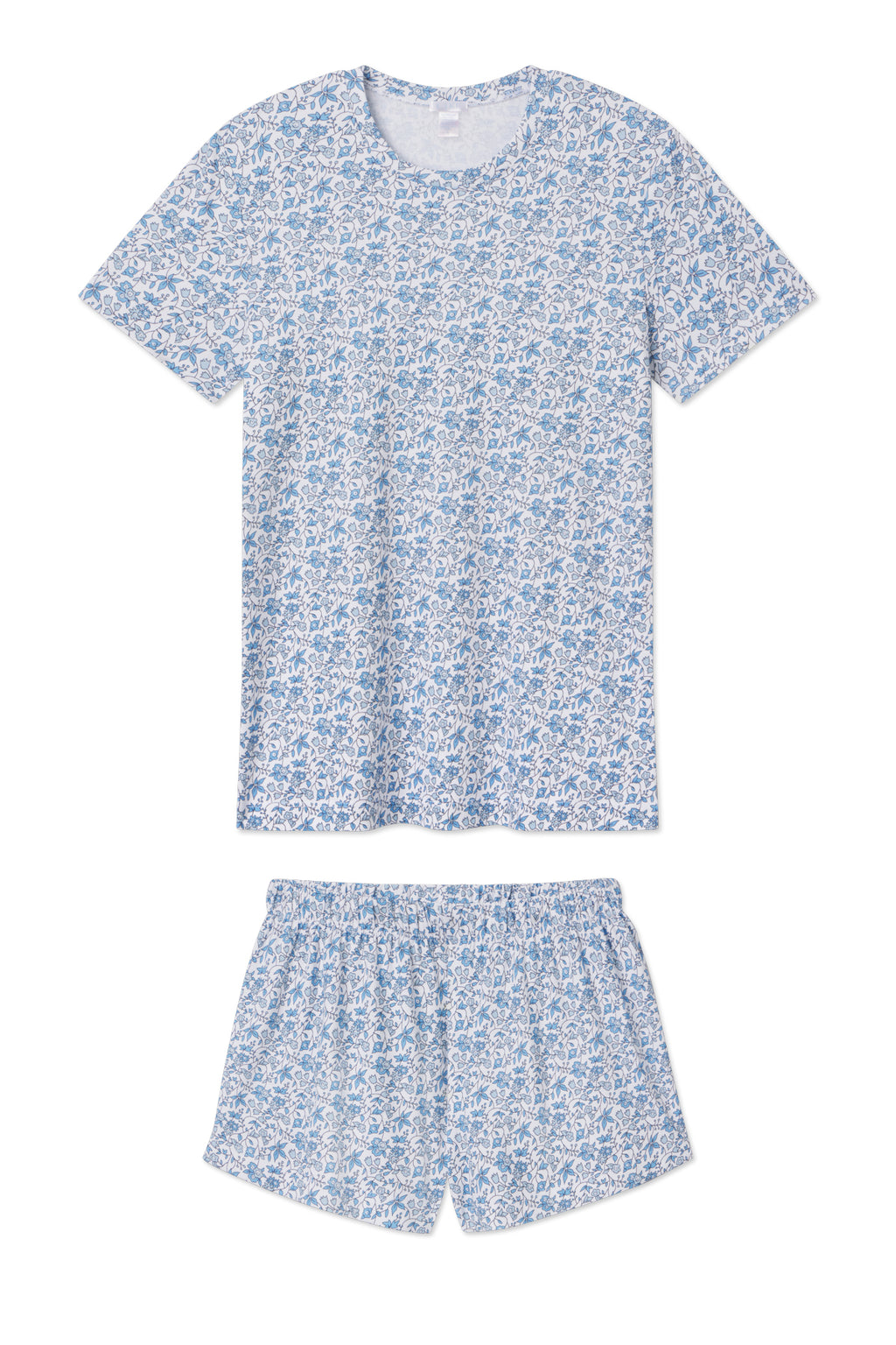 The Pima Crew Shorts Set in Delft Blue Garden Floral includes a short-sleeve T-shirt and shorts in light blue and white, made from soft Pima cotton and displayed flat on a white background.