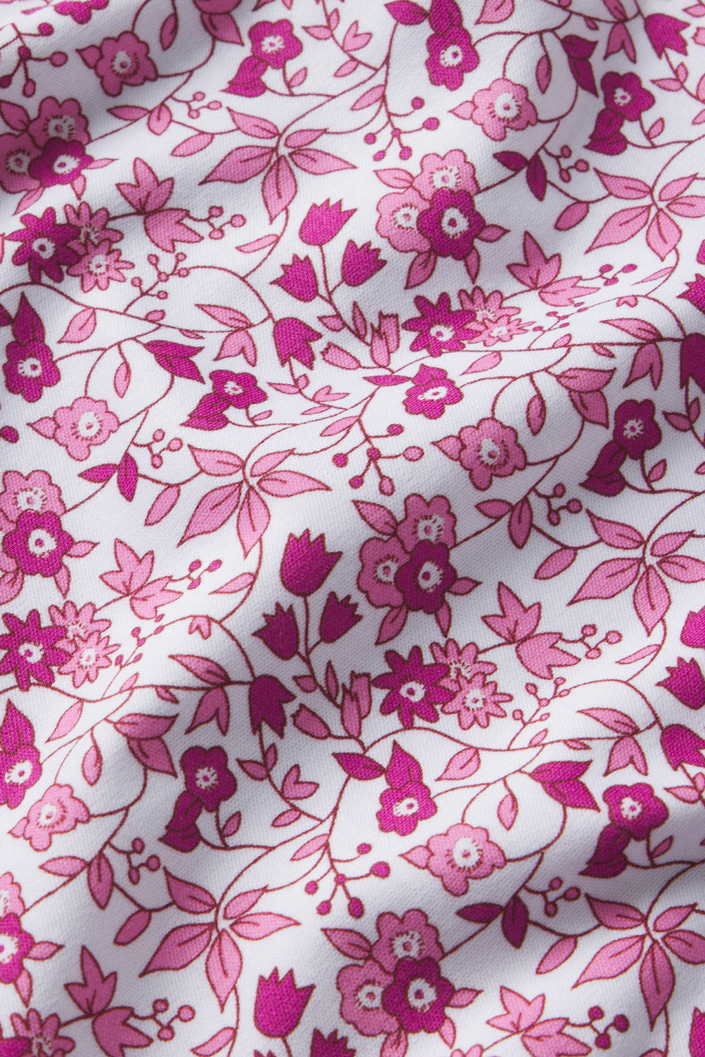 The Pima Crew Long-Short Set in Dahlia Garden Floral features a pink and magenta small floral and leaf design on white Pima cotton, offering gentle texture ideal for a pajama-inspired look.
