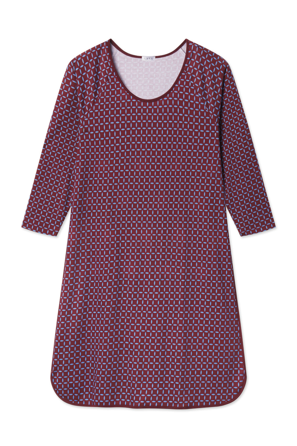 Burgundy nightgown with light blue starburst pattern, long sleeves, and curved hemline.