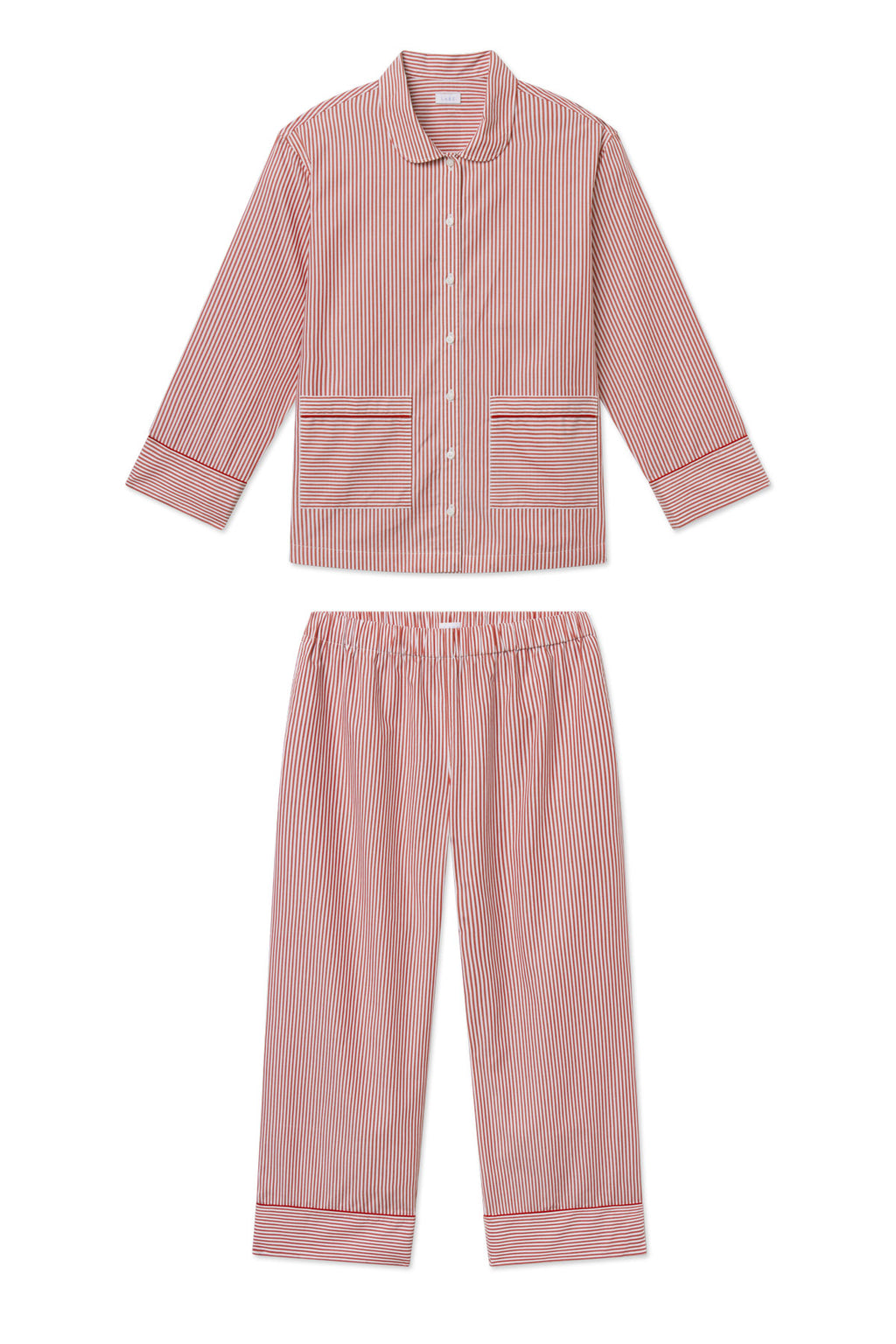 Two-piece pajama set in red and white vertical stripe poplin with piped collar, cuffs, and hem details.